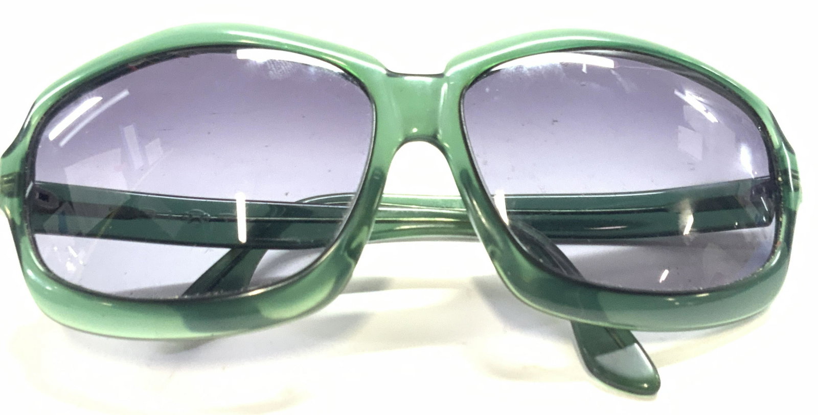 Vintage Green SIXT Sunglasses: Vintage large green framed sunglasses with SIXT marked on the arm. Ear pieces are approximately 4 inches long and frames are approximately 2.5 x 2 inches. Condition is consistent with vintage age and 