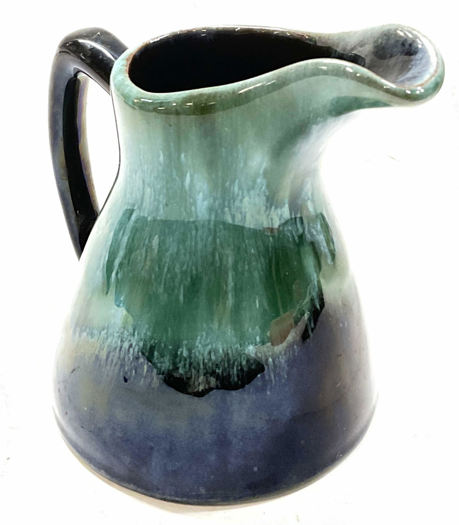 Small Ceramic Creamer: Small ceramic creamer in blue and green tone. Measures approx 4.75 x 4 inches. Surface wear consistent with age and use of piece. Kitchenalia, kitchen wear, creamer, ceramic kitchen wears, table top i