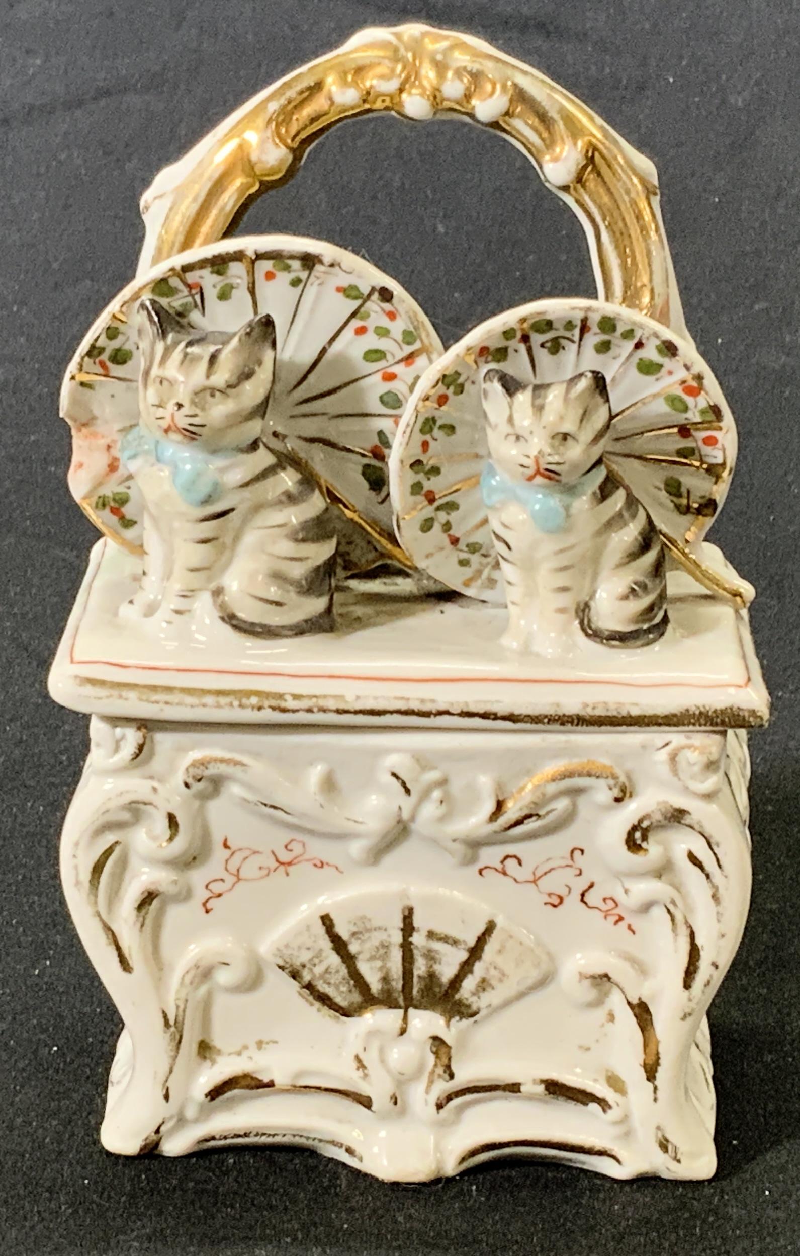 Vintage Hand Painted Gilt Cat Motif Trinket Box: A vintage hand painted and gilt porcelain trinket box with cat motif. Condition consistent with age, use, and exposure, loss to paint. Measures approx. 3 x 1.75 x 4.75 inches. Property of Palm Beach, 
