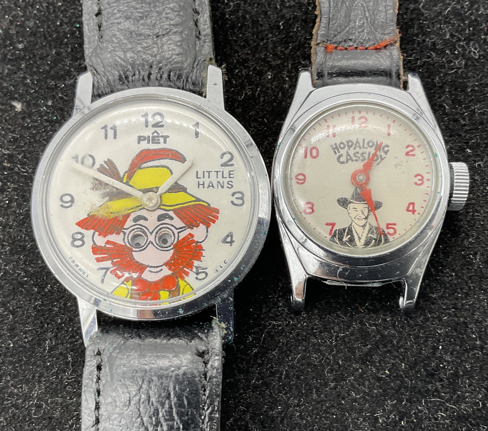 Lot 2 Vintage Wristwatches: Lot 2 Vintage Wristwatches, inscriptions read Little Hans Piet Rega Industries Calfskin 11/16 short, face measures 1 1/8 inches in diameter, strap measures 8 3/8 inches long, Hopalong Cassidy Good Luc