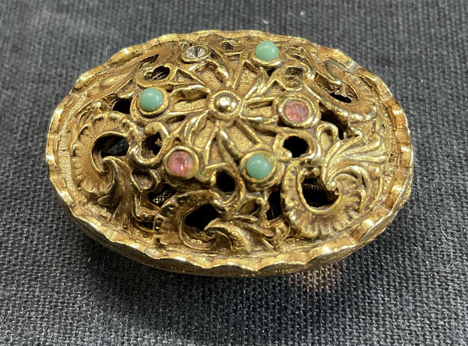 Gold Toned Jewel Faceted Vanity Accessory: Gold Toned Jewel Faceted Vanity Accessory. Open up. No solid interior, could be up cycled to a pill box or more. Measures approx 1.25 inches. Surface wear to piece consistent with age and use. Up cycl