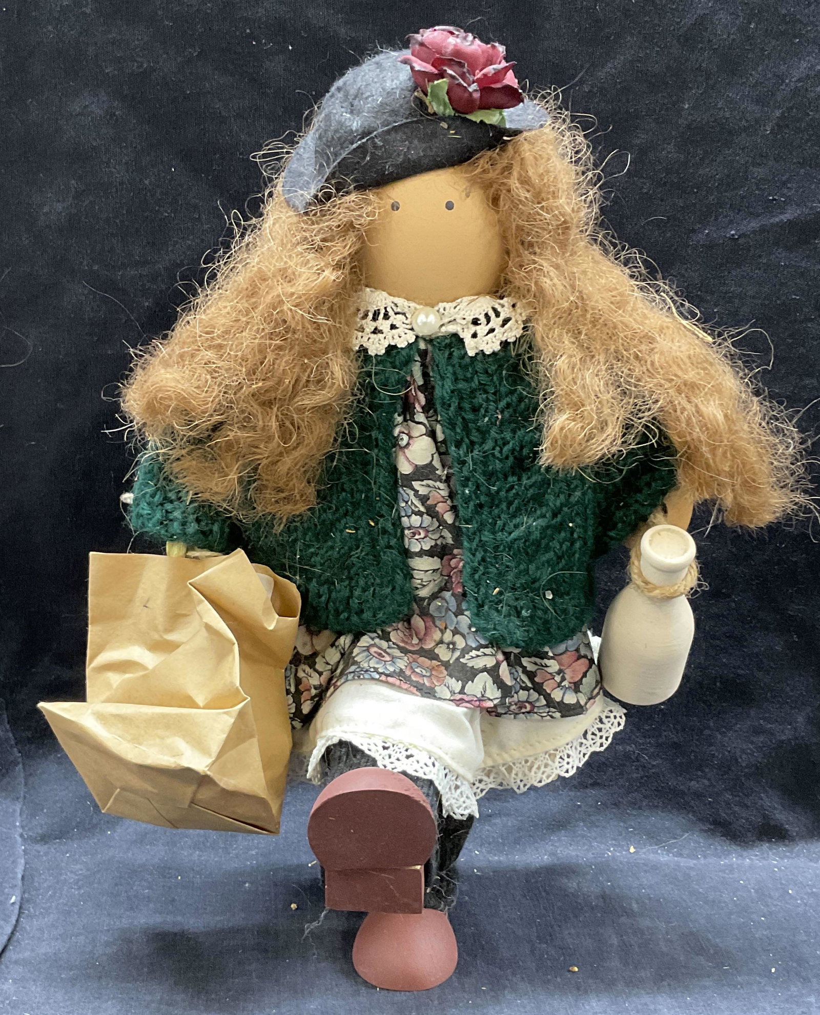 Vintage Wooden Grocery Shopping Doll: Possibly vintage wooden Doll carrying paper back and milk. Dressed in floral detailed outfit and knit sweater. Stands up by itself. Wear to piece consistent with age and use. Measure 11H inches. Doll,