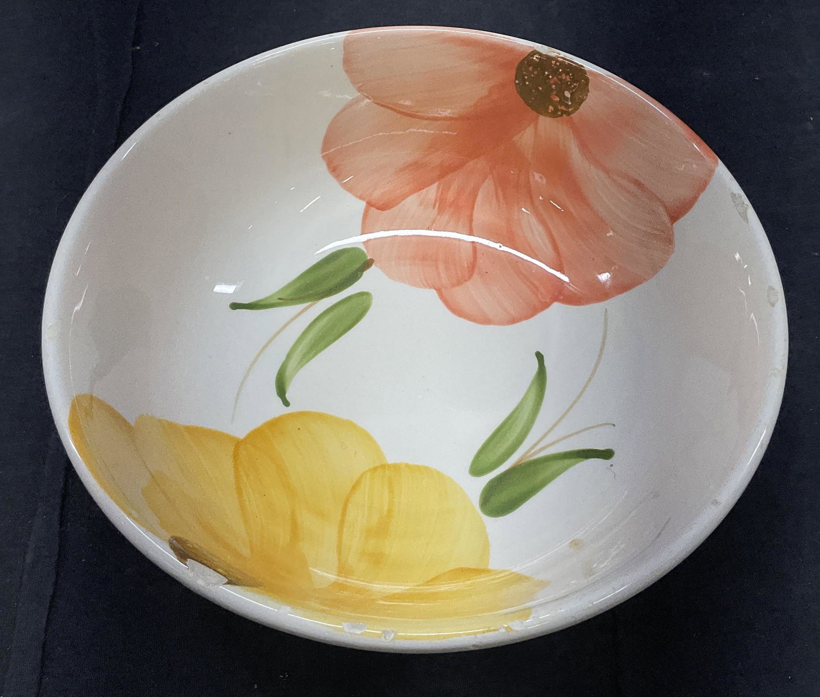 Under Glazed Hand Painted Floral Bowl, Italy: Under Glazed Hand Painted Floral Porcelain Bowl. Bottom reads made in italy, hand painted. Measures approx 9 x 3.5 inches. Chips to lip of bowl. Up cycle to flower pot. Property of Manhattan NY Estate