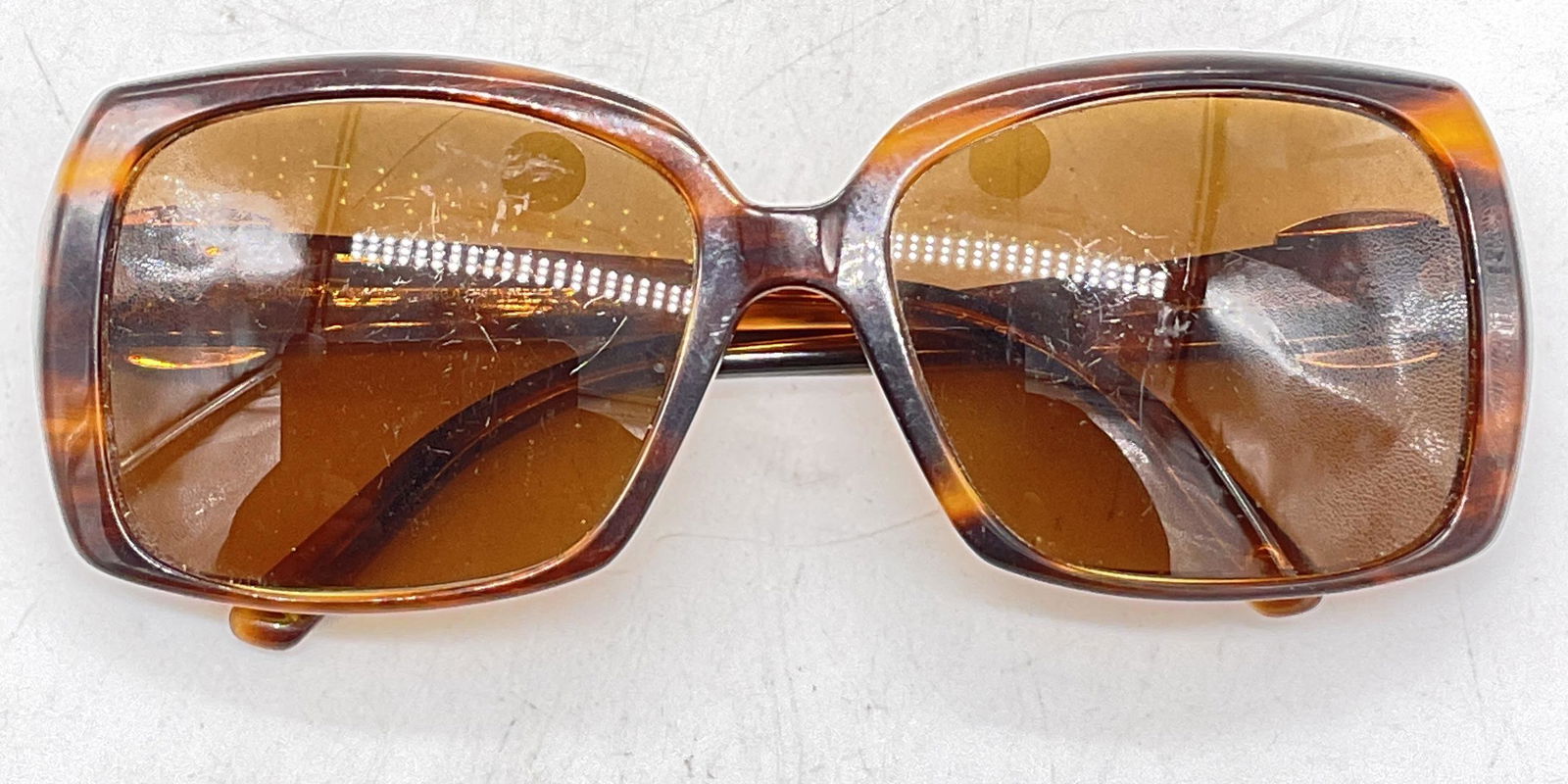 FERRAGAMO Square Lens Sunglasses, Italy: FERRAGAMO Sunglasses. Up cycle to prescription pair of sunglasses or glasses. Surface wear to pieces consistent with age and use. Measures lens 2.25 inches and ear piece approx 5 inches. sunglasses, e