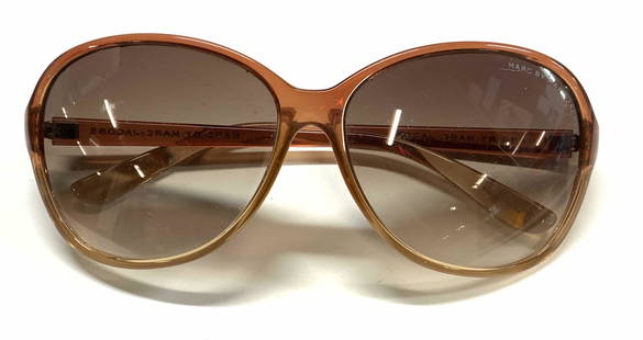 MARC BY MARC JACOBS Amber Oversized Sunglasses: MARC BY MARC JACOBS oversized sunglasses in amber. Condition consistent with use, some scratching. Measure approx. 5.5 x 6 x 2 inches. Designer label on lenses and arms, style number to interior. Marc