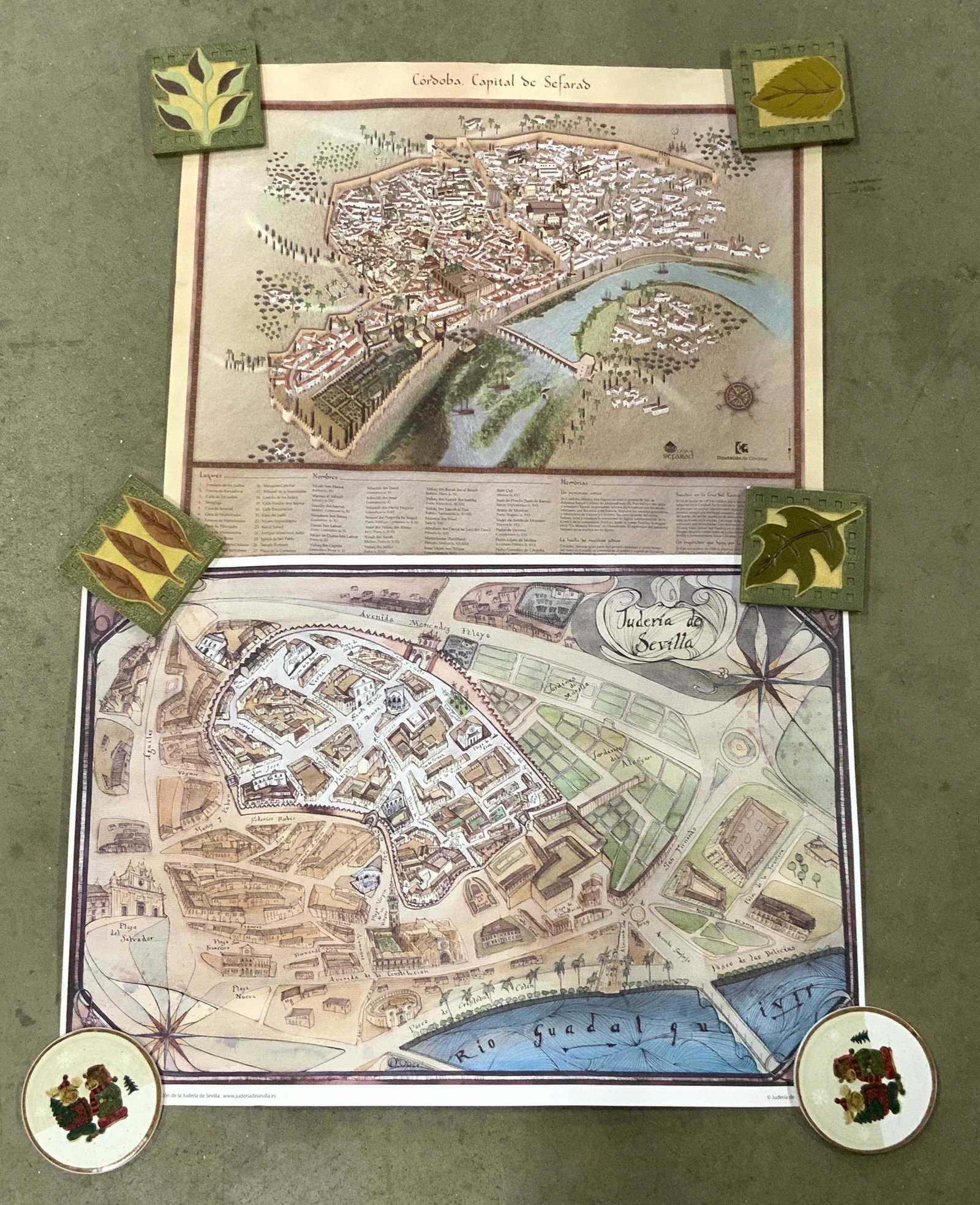 Lot of 2 Spain Map Lithographs: Lot of 2 Spain Map Lithographs, one map of Seville, and one map of Córdoba, text in Spanish, surface wear, smaller piece measures approx 19 x 22 in. Paperweights not included. SPAIN map lithographs, 