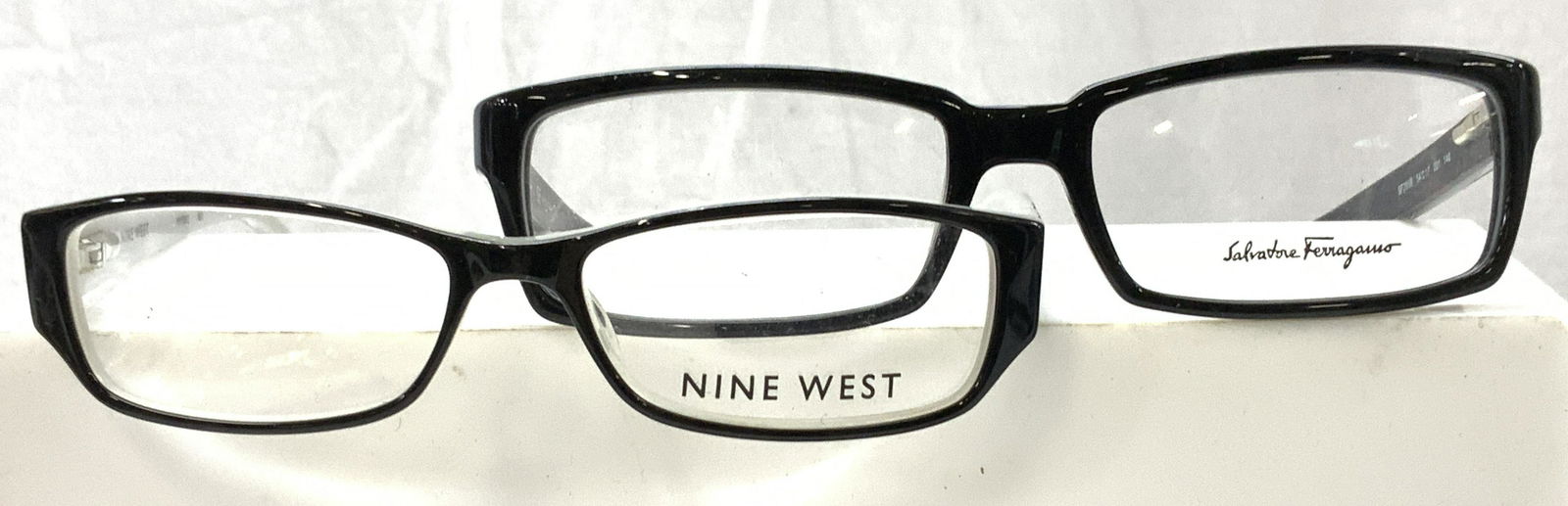 2 Pr Nine West, Ferragamo Sample EyeGlasses, sgn: Eyeglasses for reading, both black, signed with designer name- Nine West NW5012 and Salvatore Ferragamo SF2656 (Made in Italy) . These frames are store model frames in very good vintage condition, jus