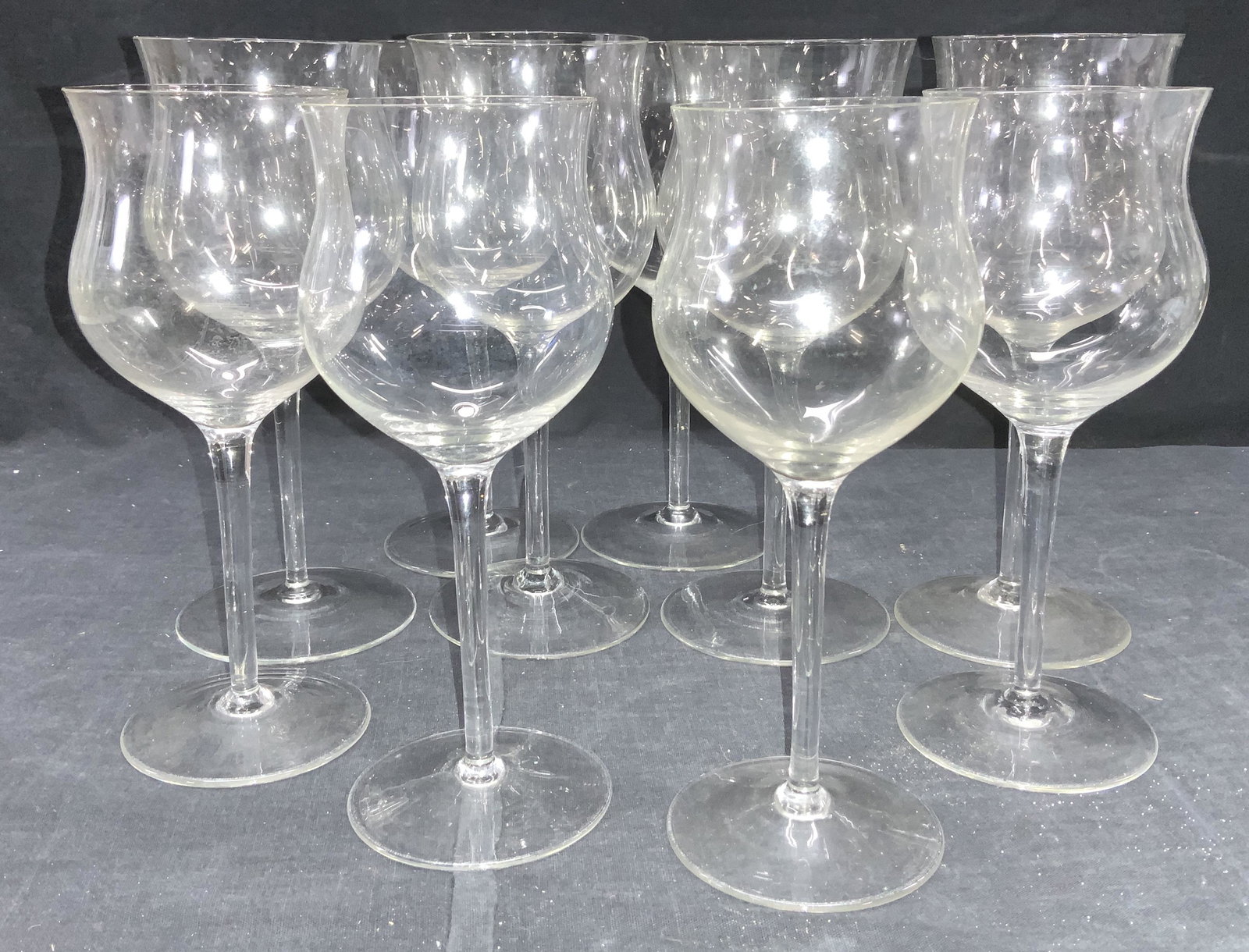 Set 10 Hand Formed Tulip Crystal Stemware: Vintage Crystal Stemware, goblet in shape of a tulip. 2 sizes. 6 that measure measure 8.5 x 3.5 in. chip to one rim. Smaller size measures 8 x 3.25 in. crystal hums and vibrates when rubbed. Property 