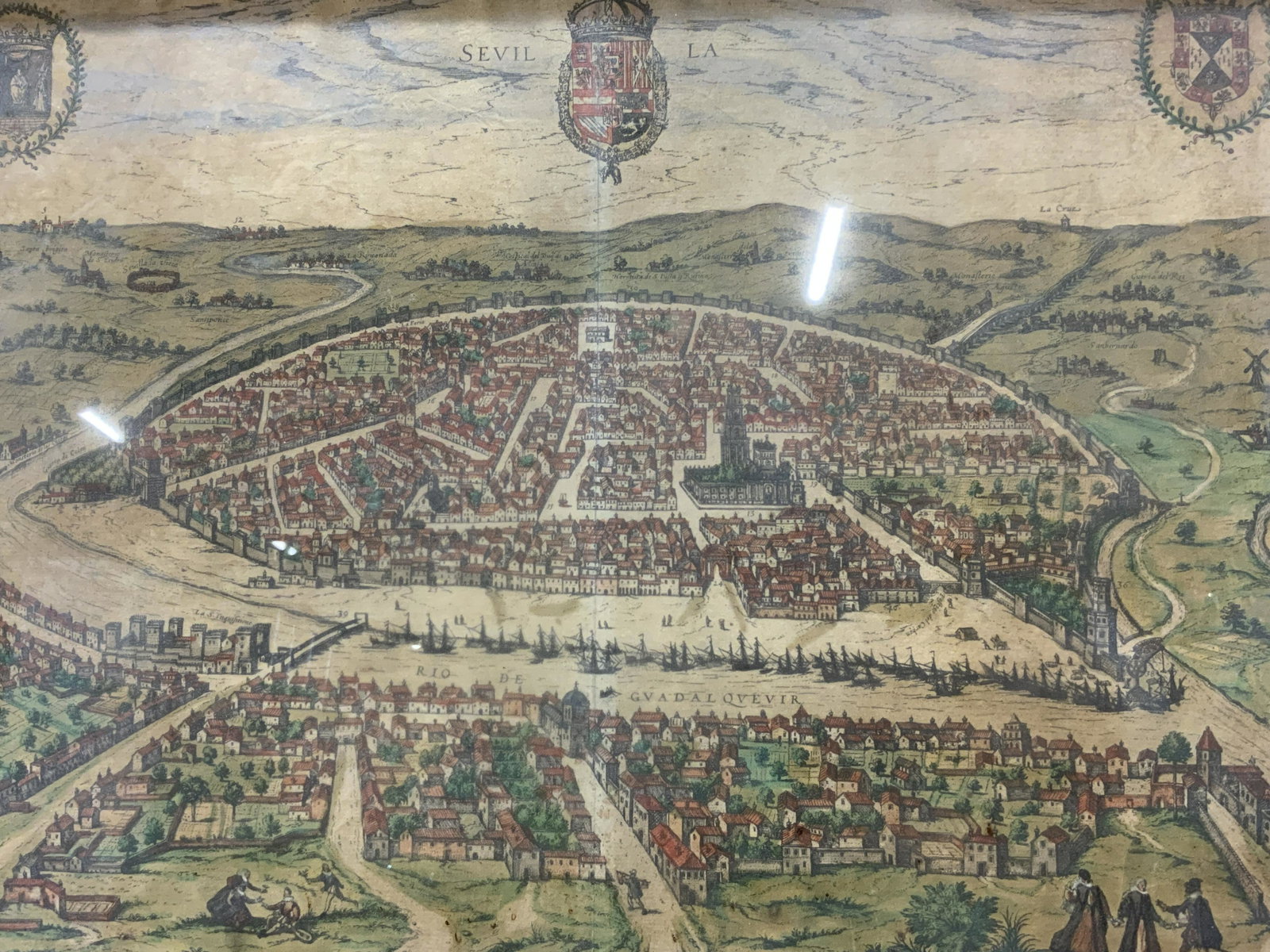 Antique Engraving of Seville: Antique Engraving of Seville, with key, text in Spanish, subject shows topographic birds eye view of Seville, in frame measures approx 15 1/4 x 20 1/4 in., brown wood frame, surface wear to frame, pro