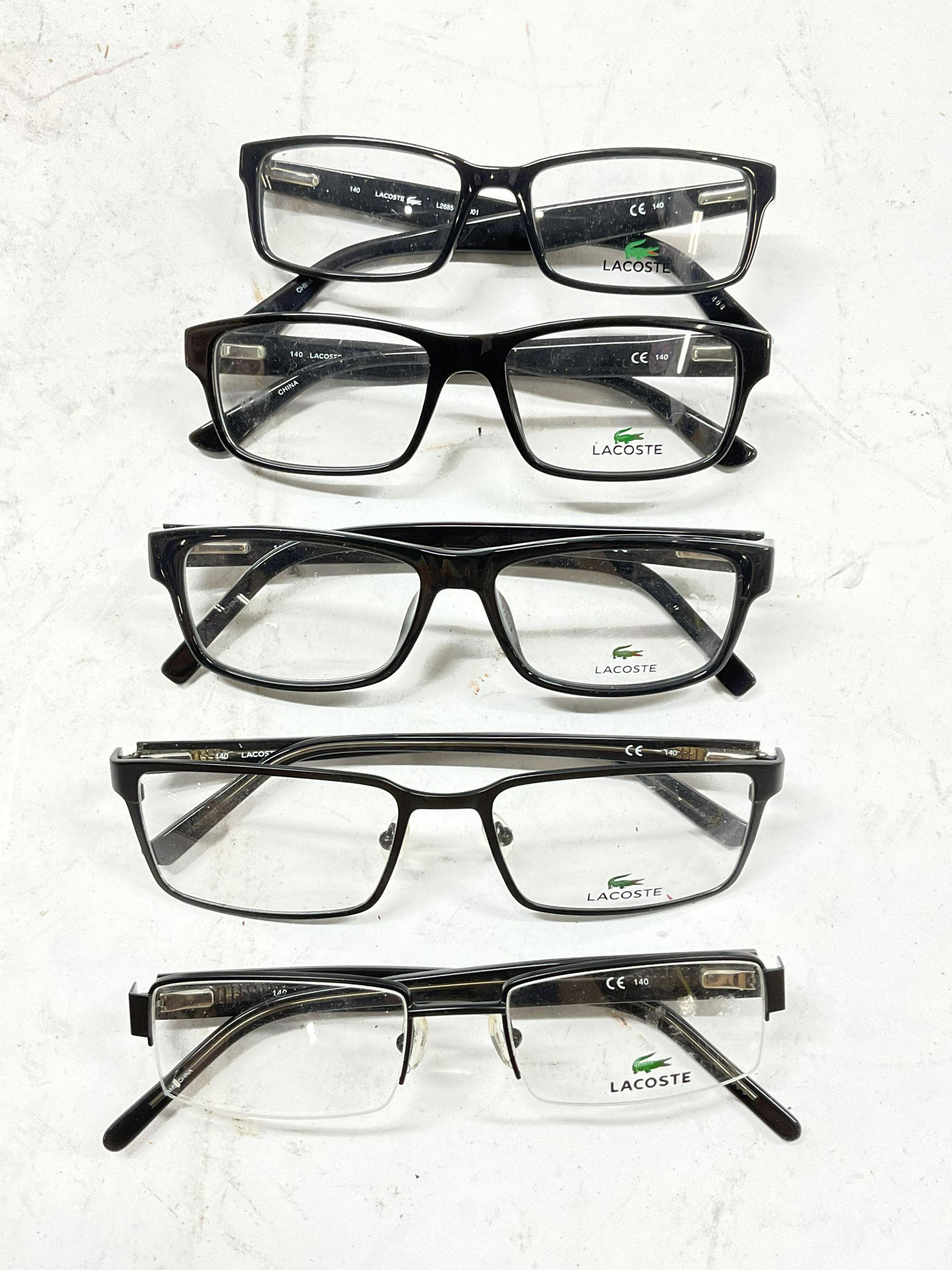 Lot 5 Lacoste Eye Glasses: Lot of 5 Lacoste eye glass frames. Up cycle to be prescription pair of eye glasses / sunglasses, largest measures approx, lens 2 inch, ear piece 6 inches. Surface wear consistent with age and use. Eye