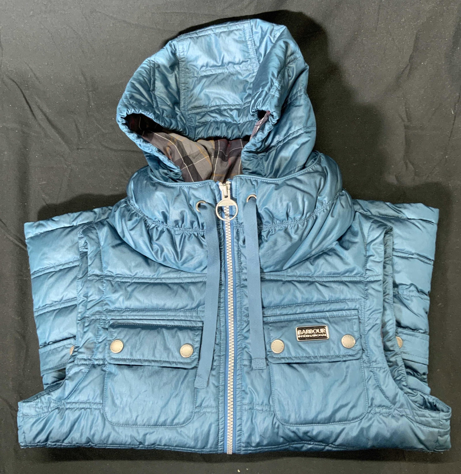 BARBOUR INTERNATIONAL Teal Fibre Down Vest NWT: BARBOUR INTERNATIONAL fibre down zip up vest in teal. Size 6. Has removable hood. New with original tag. Small stain to front. Barbour International, fibre down, down vest, ladies vest, ladies fibre d