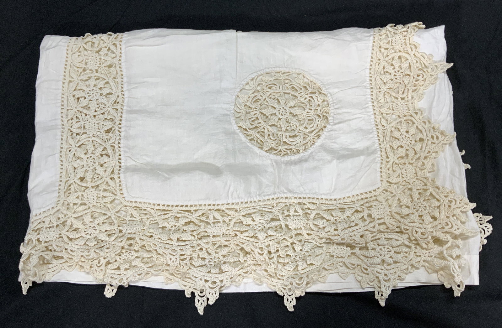 Vintage Cream Crochet Lace Table Linen: A vintage cream colored rectangular extra long tabletop textile with crochet lace trim. May be used as a tablecloth or upcycled for crafting or other textile projects. Condition consistent with use an