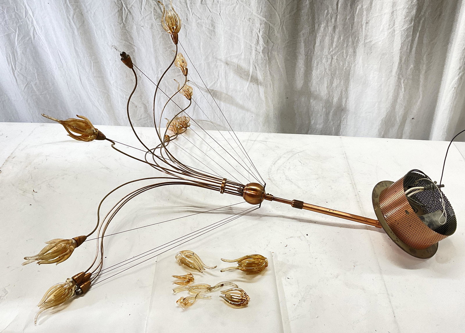 Copper Minimalistic Chandelier W Art Glass: Copper Minimalistic Chandelier With Art glass. Metal is possibly copper. Measures approx 30 inches in length, & approx 32 inches in wide. Art class pieces to chandelier are damaged and some are not at