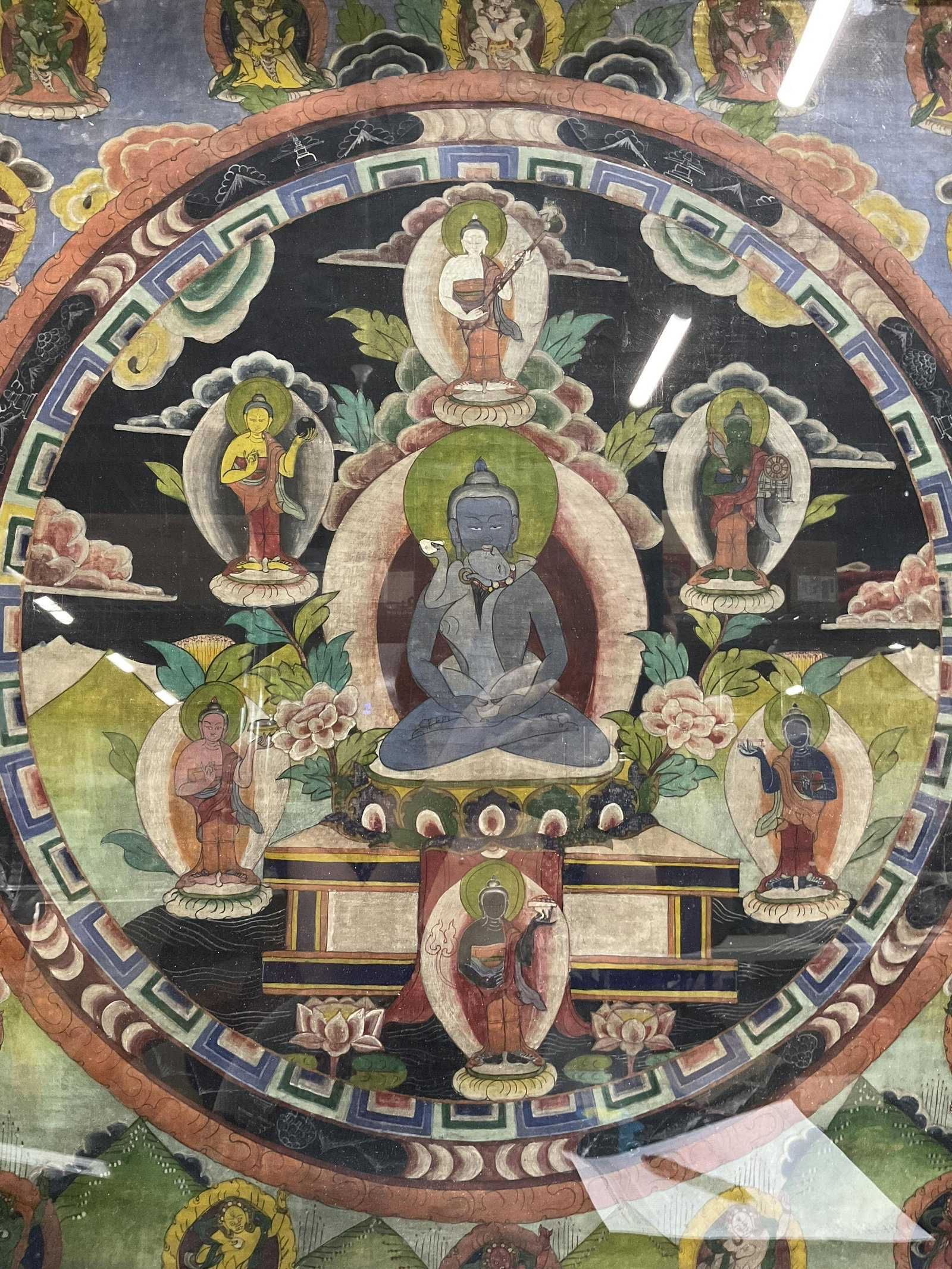 Buddhist Thangka Style Painting: Buddhist Thangka Style Painting, no apparent inscriptions or signatures, label to reverse reads ‘Frame King’, not examined out of frame, subject a mandala filled with depictions of various deities