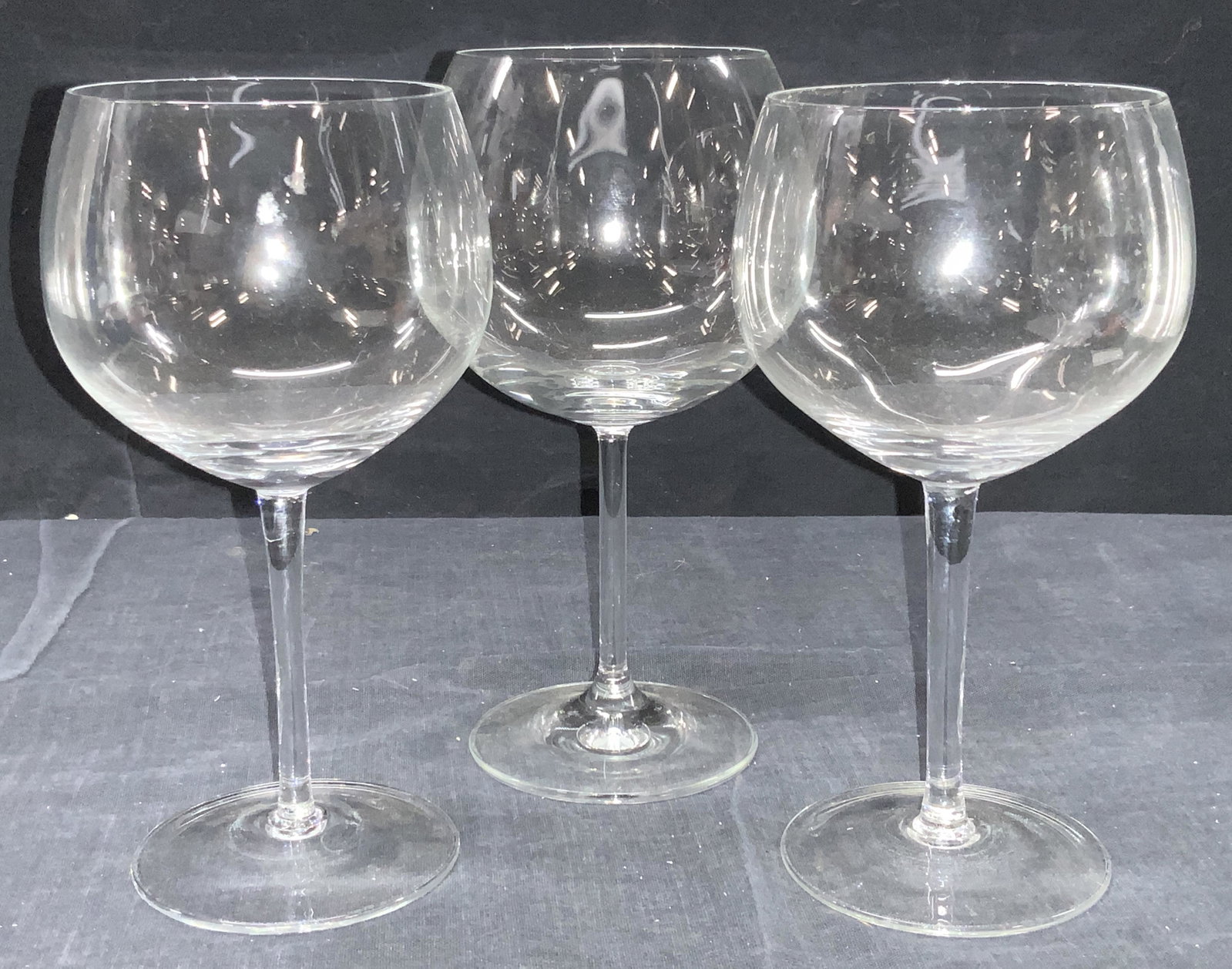 3 Clear Crystal Wine Glasses: Group lot of 3 crystal wine glasses. 1 taller than the other. Approximately 7.5 inches tall. Property of Martha Stewart Katonah, N.Y. Estate. Martha Stewart estate stemware, crystal stemware, crystal 