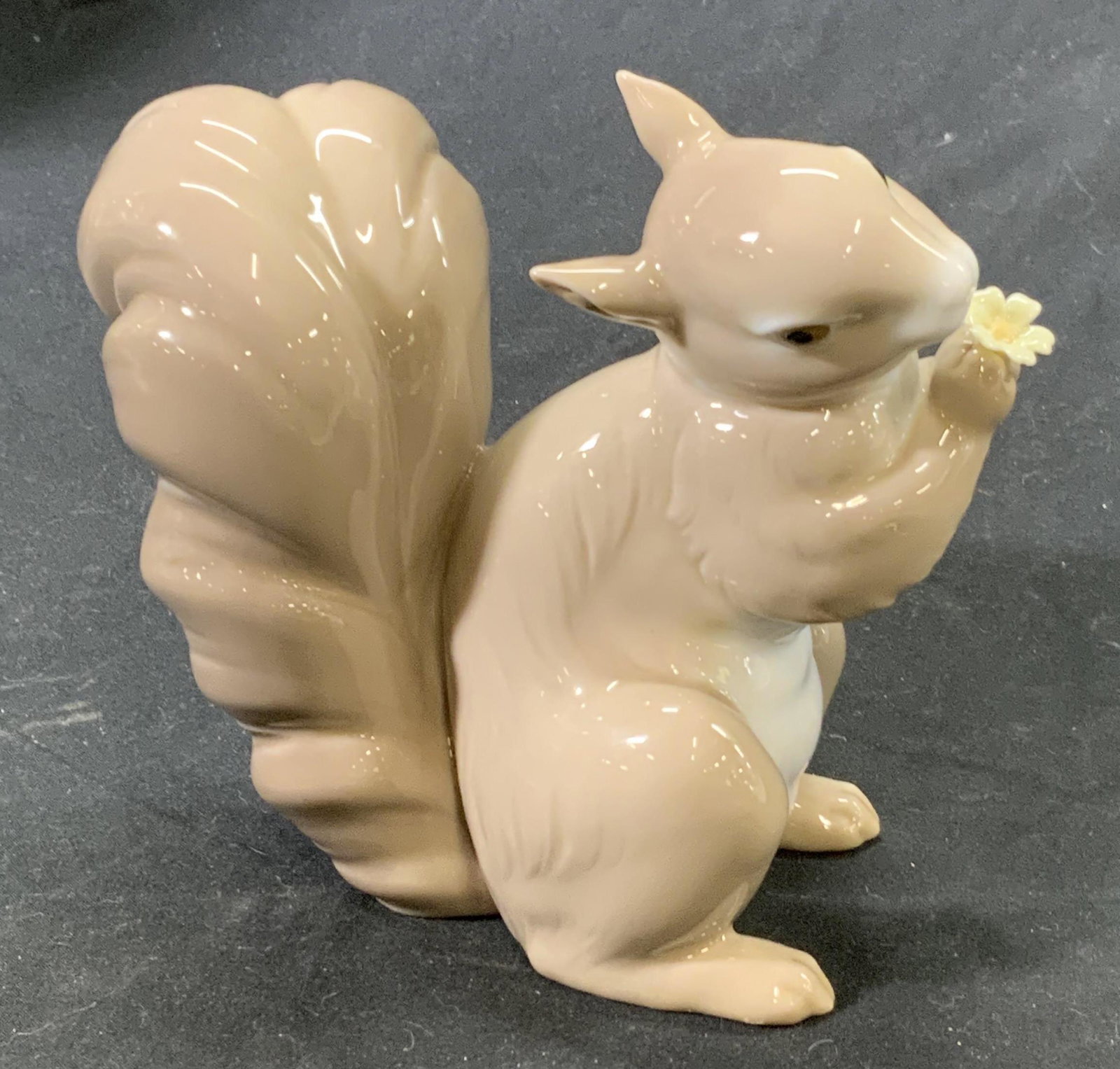LLADRO Squirrel with Flower Porcelain Figurine: Vintage Lladro design number 6410 Would You Be Mine? Porcelain squirrel figurine in soft brown. Measures approx. 5 x 5.5 inches. In good condition. Marked LLADRO to underside, potters marks present. L