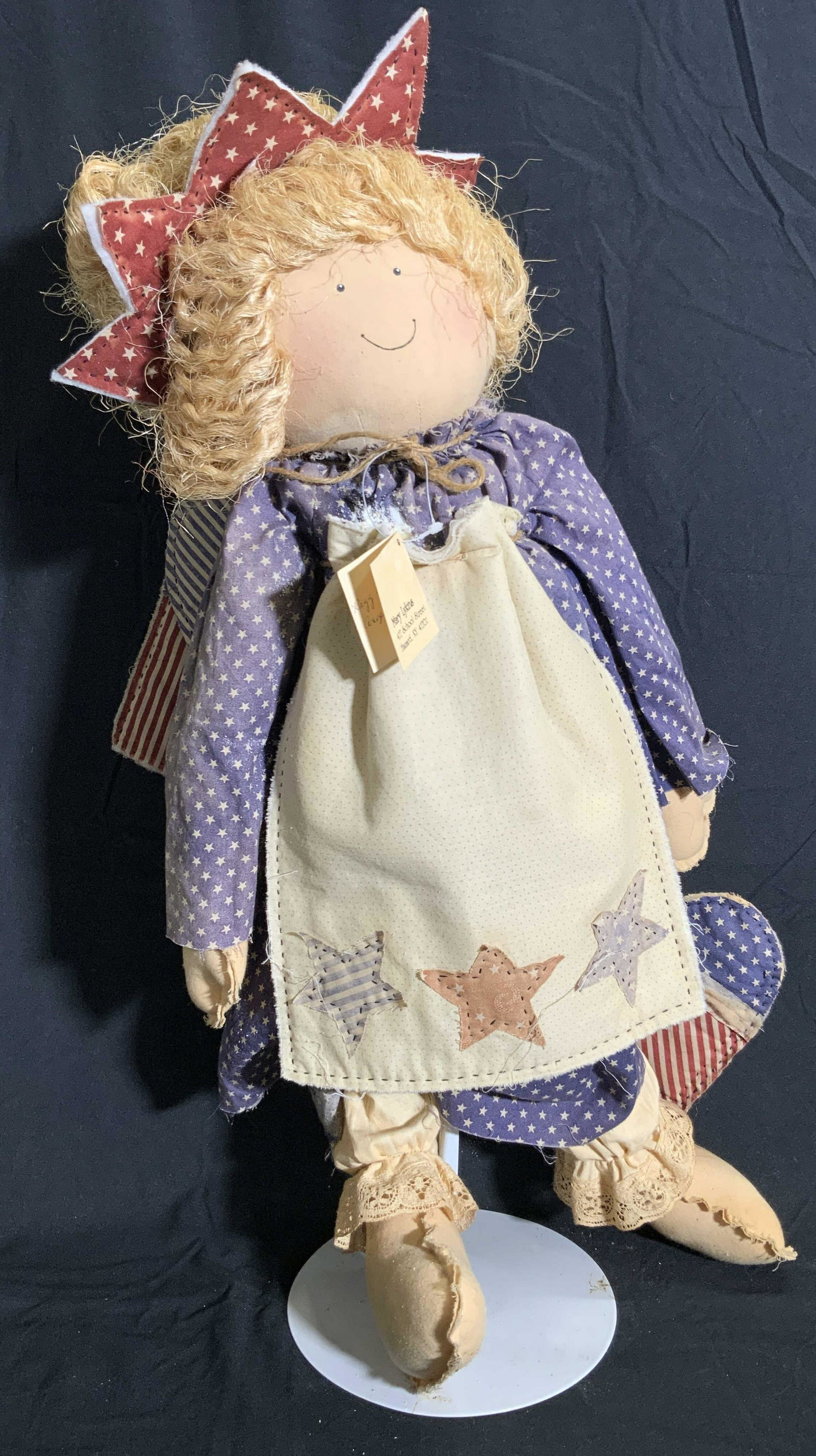FRIENDS FOREVER Vintage MARY LYKINS Flag Doll: A vintage fabric stars abs stripes flag motif doll. Designs are red, white, and blue stars & stripes. American flag to reverse. Tag reads FRIENDS FOREVER, MARY LYKINS, C. 1991. Comes with metal stand,