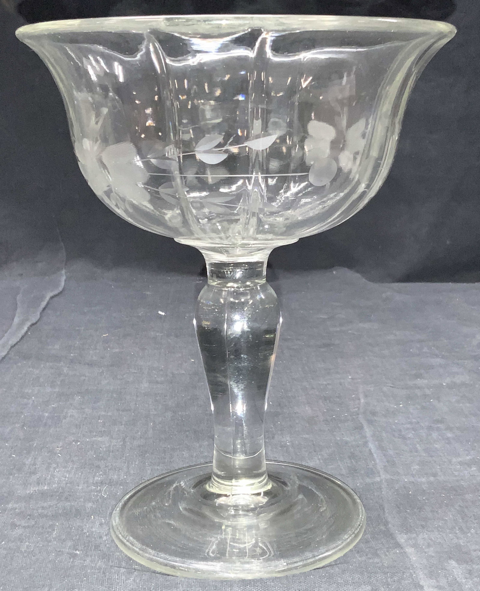 Vintage Molded Glass Footed Etched Taza: A vintage molded glass footed dish, taza. Etched with floral motifs on exterior of dish. Approximately 7 inches tall. Vintage molder glass, molded glass, glass taza, glass candy dish, glass dish, disp