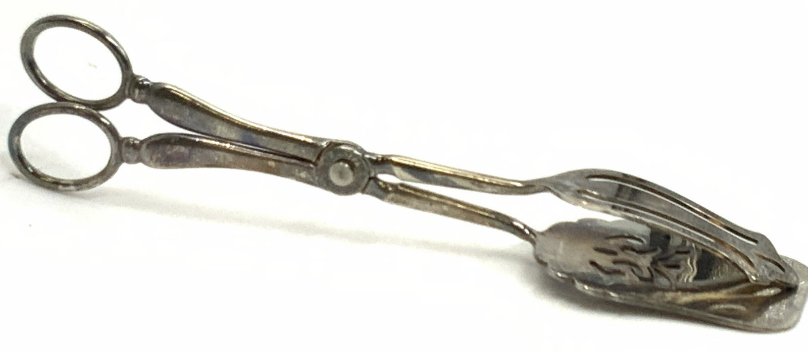 EASLES Vintage Italian silver plate Pastry Tongs: Pair of pastry tongs, 1 half with a flat curved top and other half being flat and wide. Marked on handle, EASLES, 1779, SilverPlate, Italy. Approximately 8.75 inches tall. Condition is consistent with