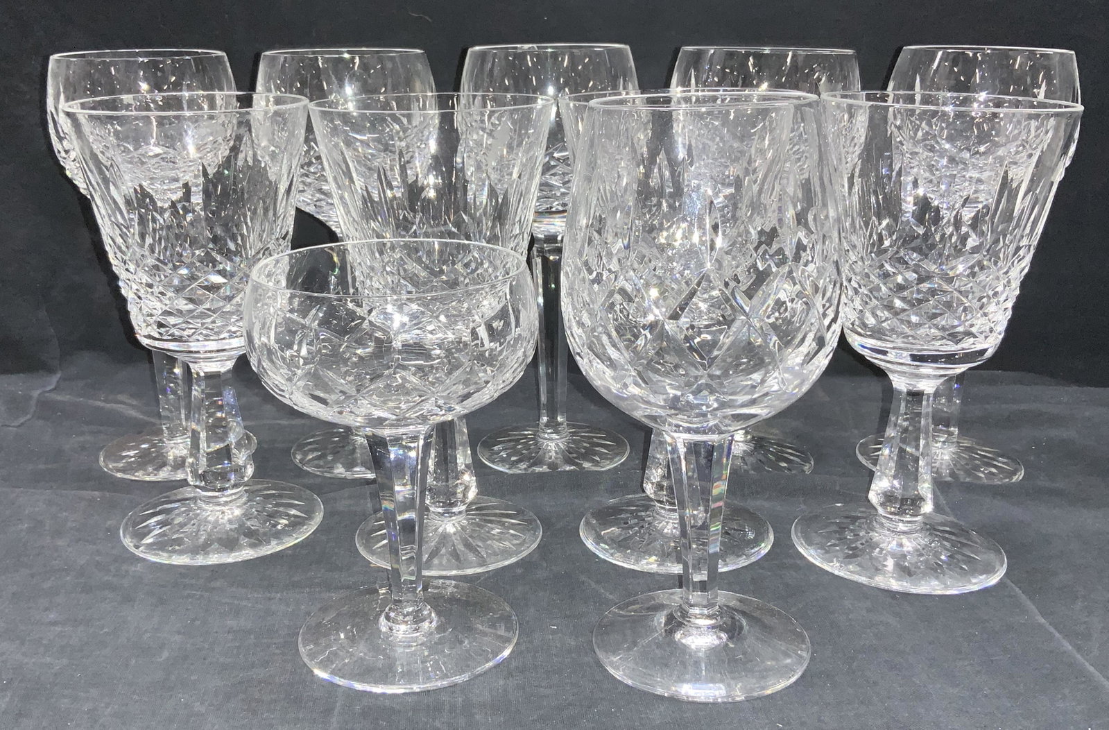 Set11 WATERFORD Signed Crystal Stemware, Ireland: Vintage Waterford Cut Crystal stemware, consist of round and oval Goblets, vintage champagne glass and reverse bell shape. Waterford acid mark on pieces. Goblet 7.5 in ht x 3.5 in wide. Chip to rim on