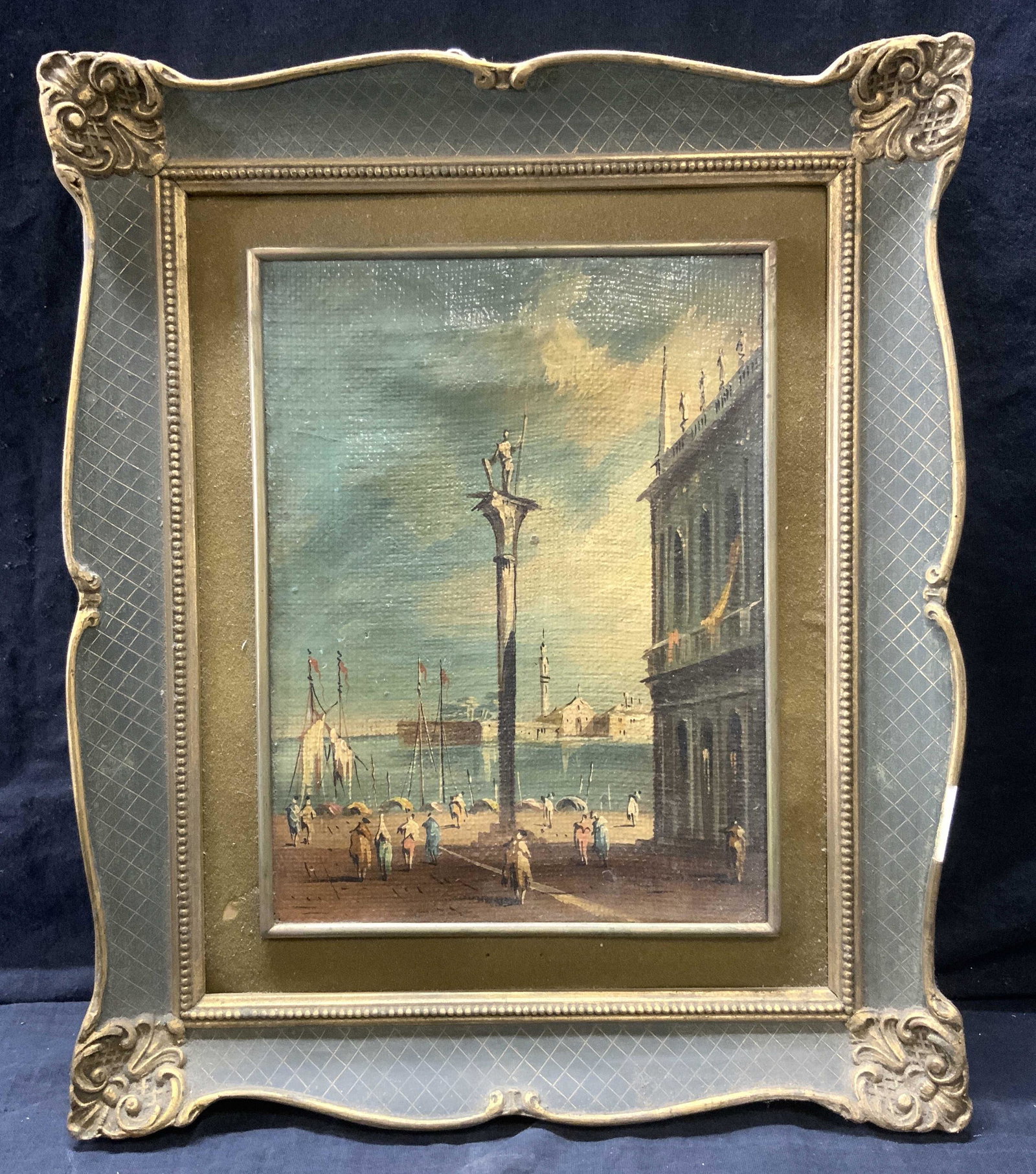 Venetian Style Landscape Antique Painting: Venetian Style Landscape Antique Painting, oil on canvas, subject shows impressionist figures roaming a city square with a harbor and more buildings across the water, in ornate wood and gold toned ena