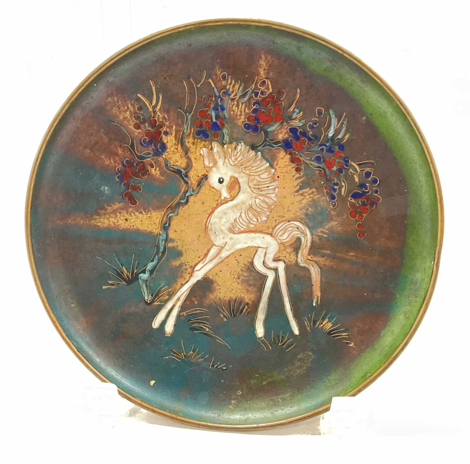 Copper Painted Plate W Horse Illustration: Possibly copper dish, painted with a small white horse figure and tree. Style reminiscent of Hieronymus Bosch Figures. Marked illegibly on back. Measures approx 7 x 1 inch. Copper plate, wall decor, h