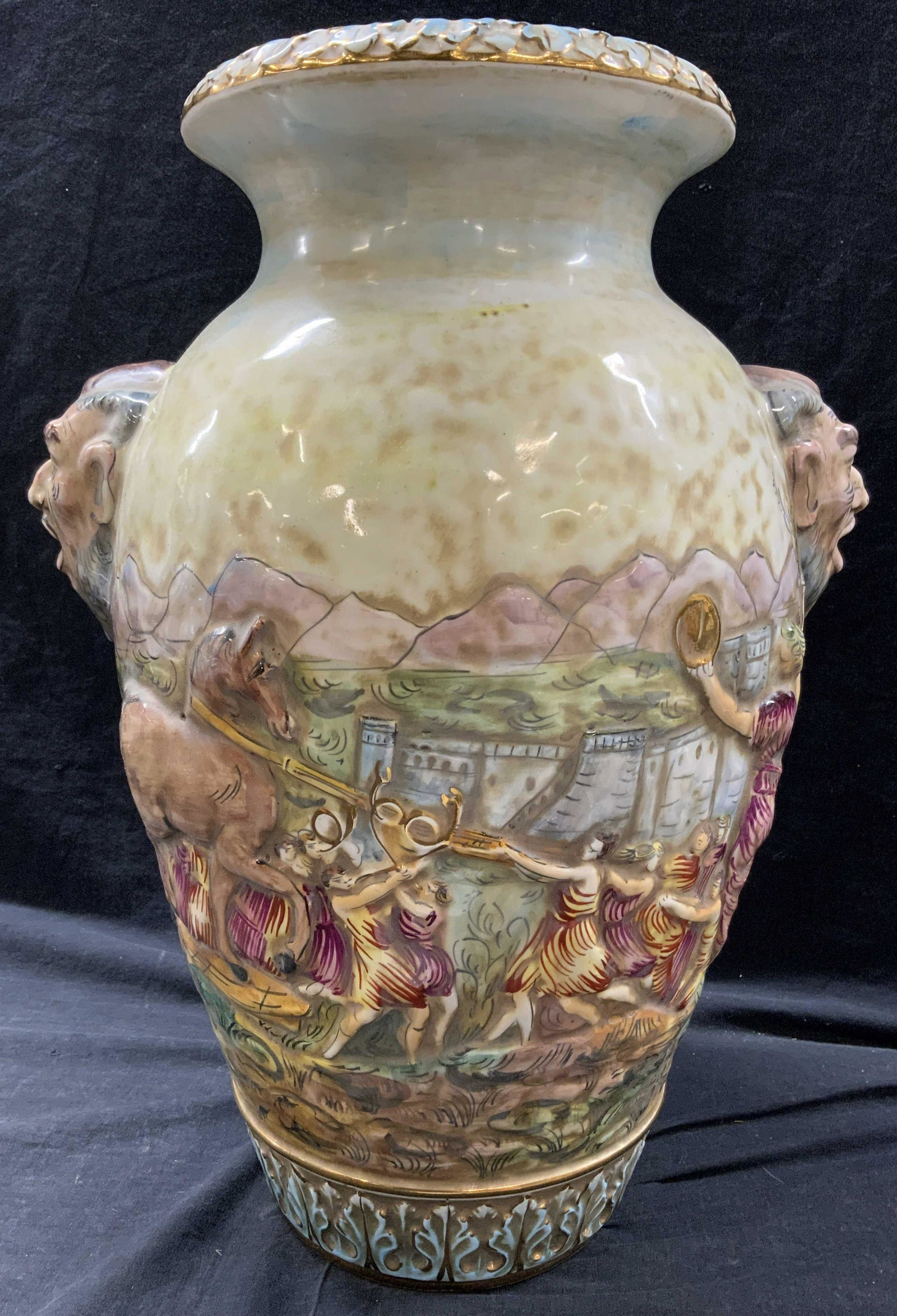 CAPODIMONTE ITALY Hand Painted Vase Vessel: Underside is signed CAPODIMONTE ITALY 1421. Vase has hand painted elements. Piece has beveled figural head handles. Vase has intricate landscape detail. Rim & base have gilt detail. Vase, vessel, Ital