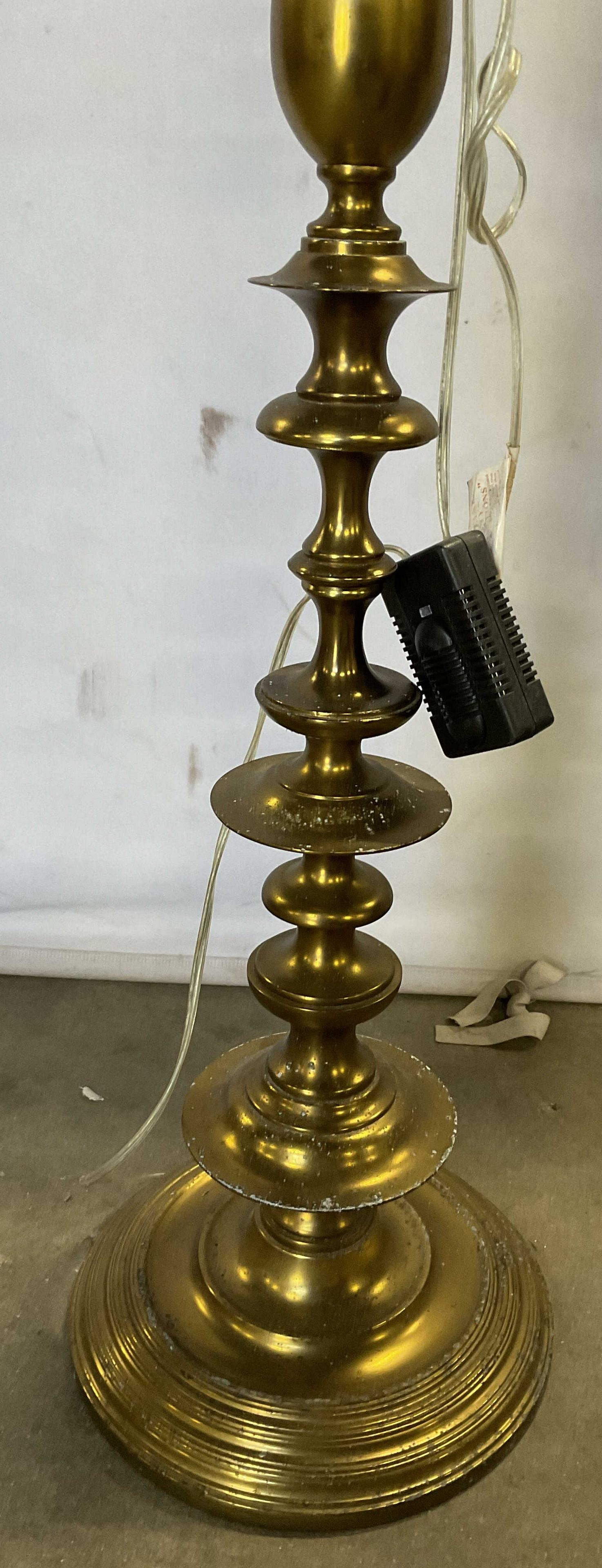 Martha Stewartâ€™s Vintage Gold Toned Floor Lamp: Gold Toned Floor Lamp with wiring. Measures approx 67 inches in height, base approx 13inches. Surface wear consistent to age of piece. Not tested for functionality, no shade included. Property of Mart