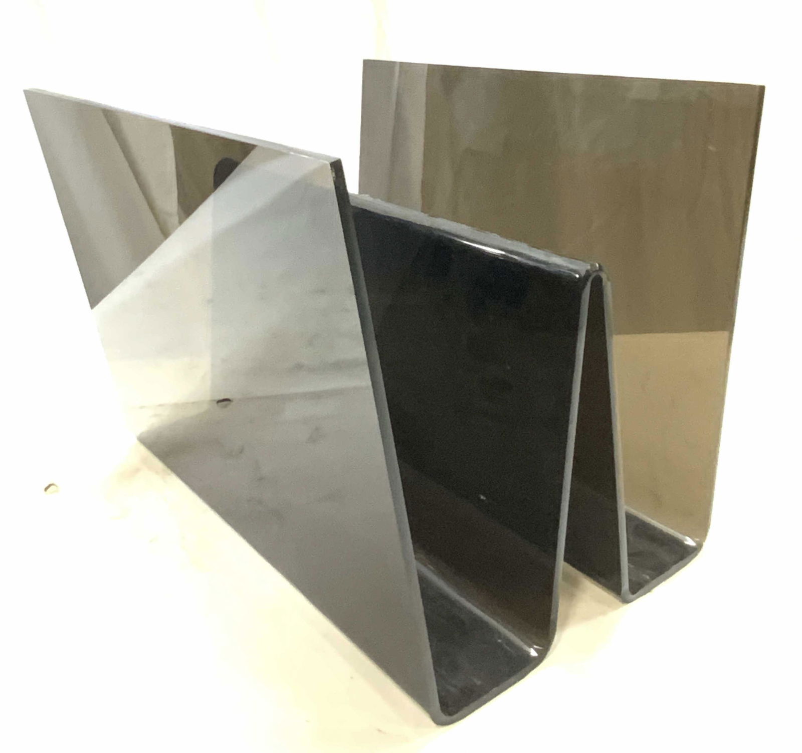 Mid Century Modern Smokey Lucite Magazine Rack: Mid century modern Smokey hued lucite magazine rack. Condition consistent with use and exposure, scratching present. Measures approx. 16 x 12.25 x 12.25 inches. Mid century modern, mid century modern