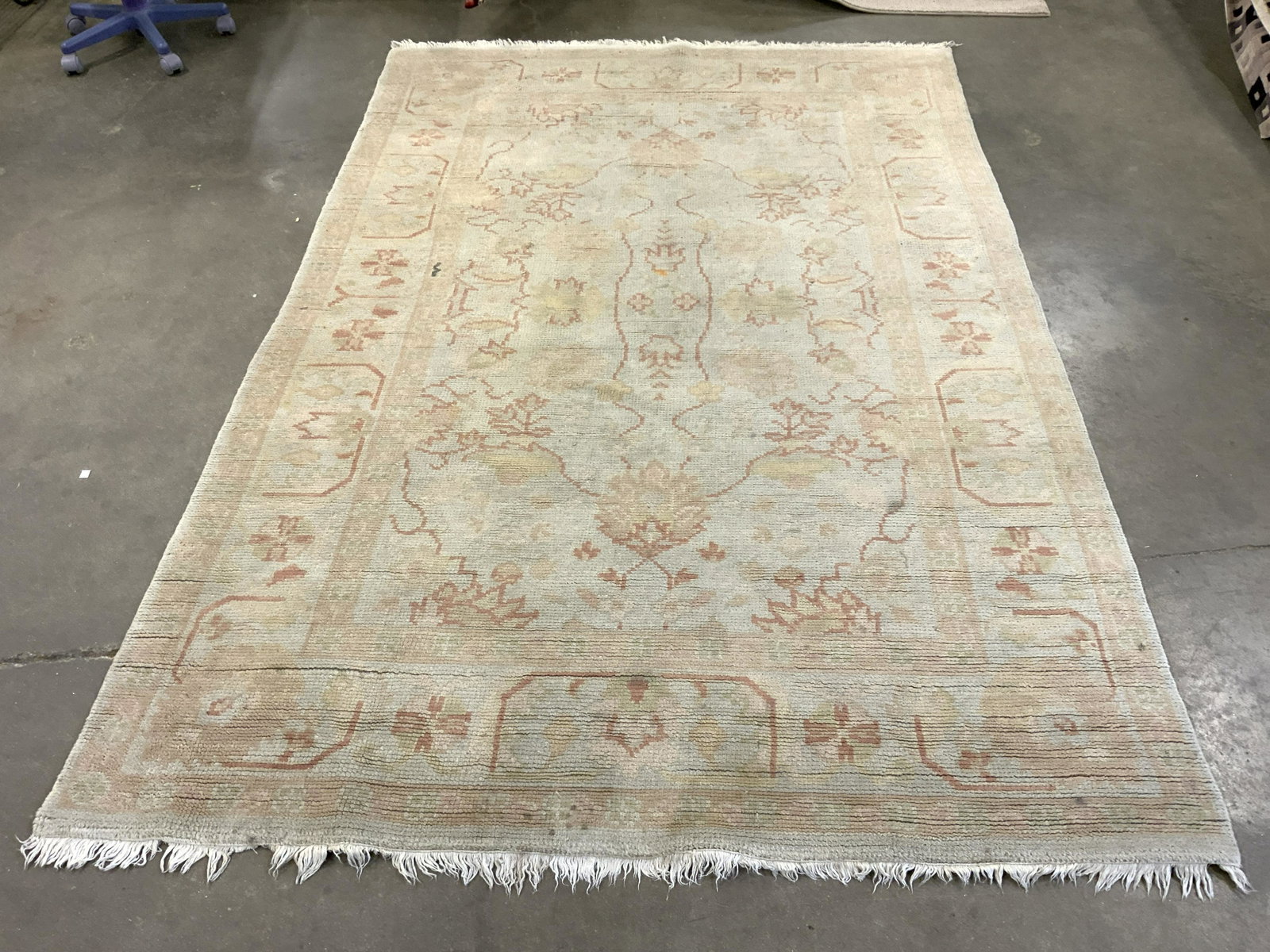 Vintage Handmade Fringed Wool Area Rug: Rug is handmade and wool. Piece is vintage. Rag has cream toned fringes at edges. Piece has multi toned floral, vine & leaf detail. Piece measures approx 104 inches long 67 inches wide. Rug, carpet, v
