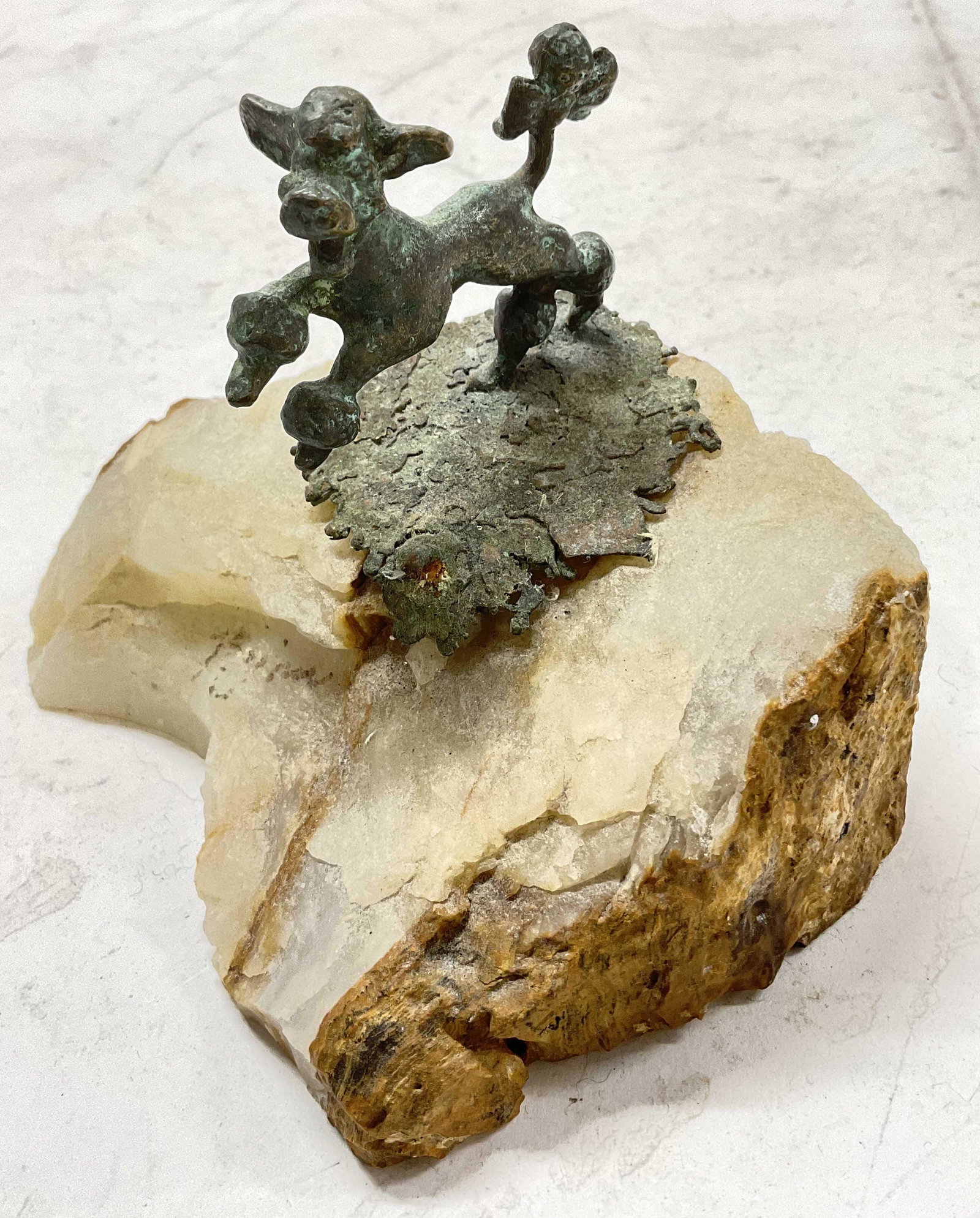 Signed Bronze Sculpture on Natural Stone Base: Signed Bronze Sculpture on Natural Stone Base. Signed illegibly. Sculpture of a poodle. Measures approx 7 x 5 inches. Surface wear to piece consistent with age and use. 11 Miniature bronze sculpture, 