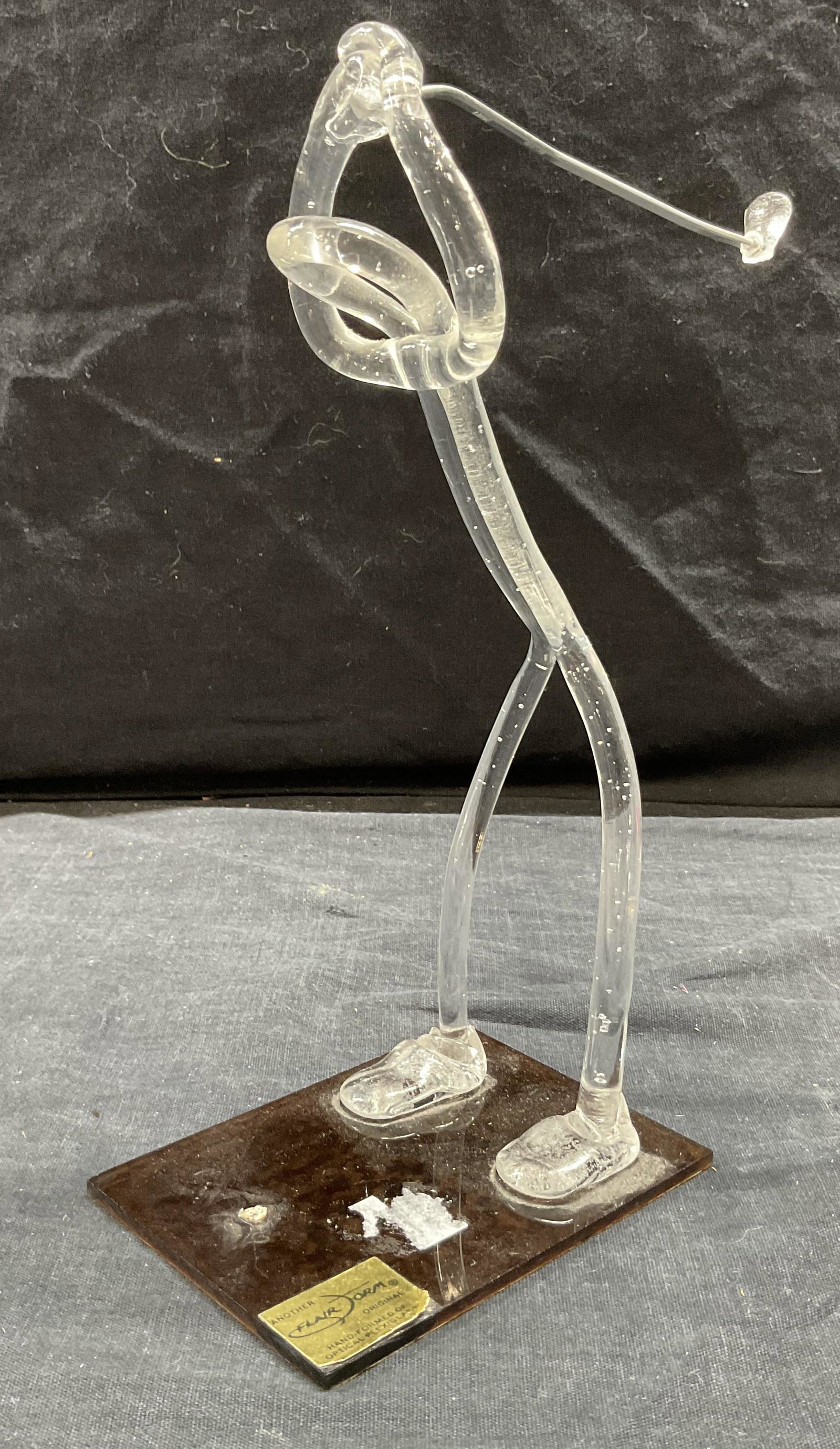 FLAIR FORM Plexiglass Golfer Sculpture: FLAIR FORM Plexiglass Golfer Sculpture, label reads Another flair form original hand formed of optical plexiglass, a figure in mid golf swing, measures 8 5/8 inches tall x 6 3/4 inches wide, surface w
