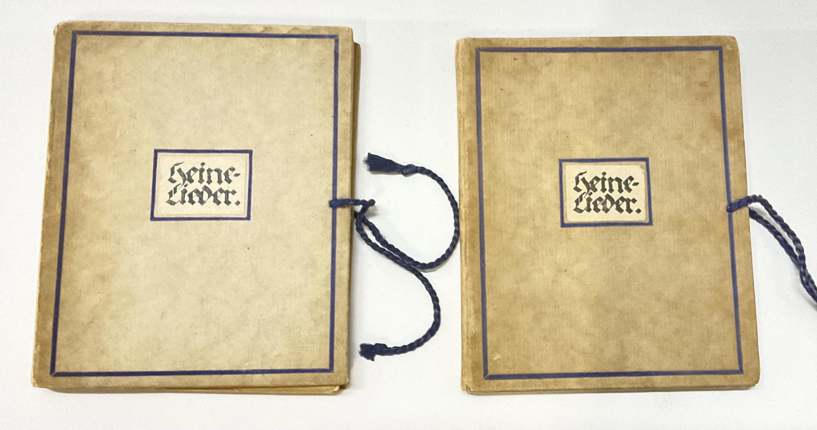 Lot 2 Miniature Booklets, Heine- Lieder, Schulhof: Lot 2 Miniature Booklets with cards inside. Title translations reads ‘Heine Songs, Drawn on stone by Hermann Grom-Kotimayer and written by Juma Schulhof.’ Some illustrations throughout two booklet