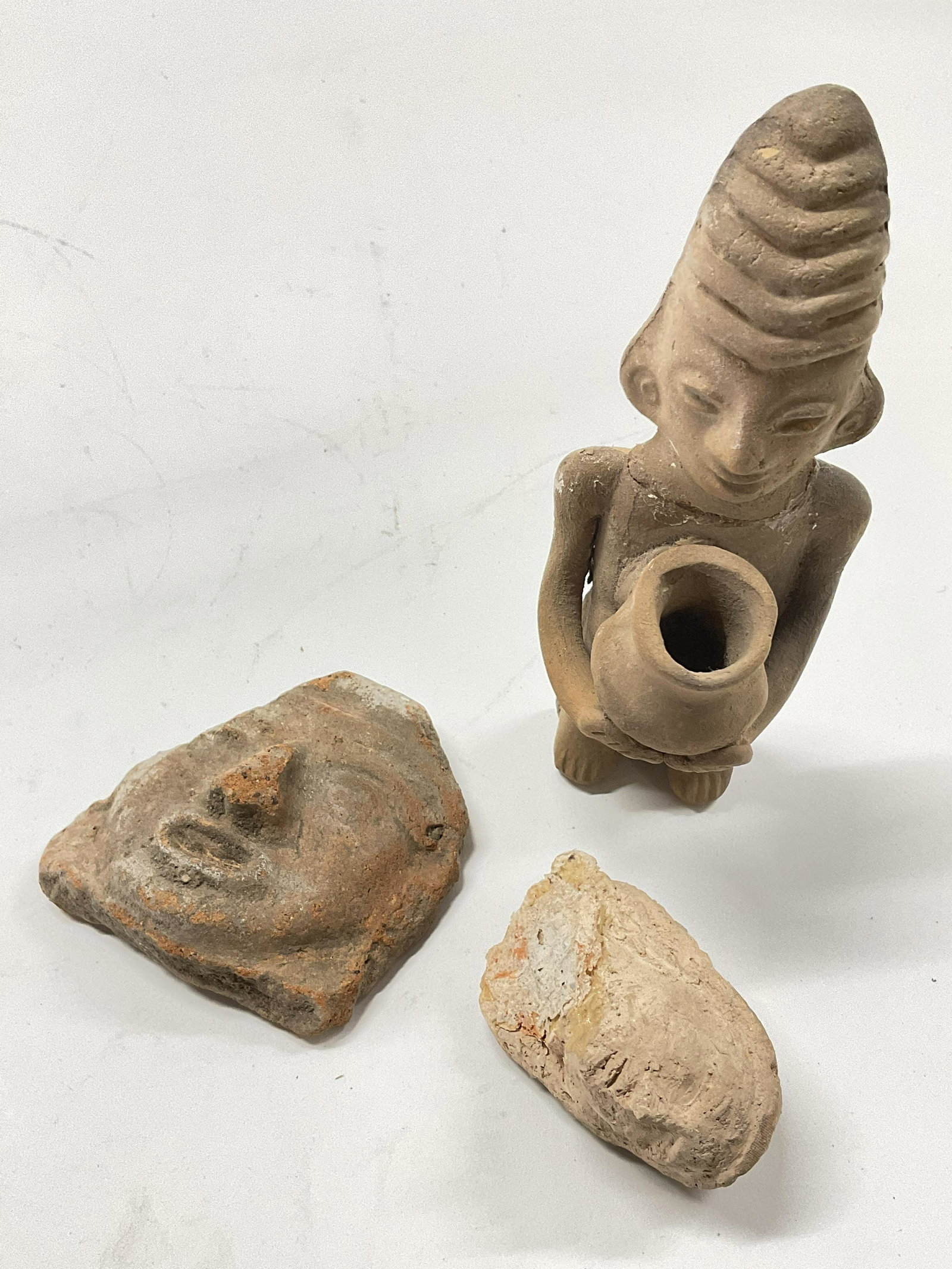 Lot 3 Clay Miniature Art Pieces: Lot 3 Clay art pieces. Fragments of Clay art. Possibly vintage. Prior repair to pieces. Up cycle pieces to form sculpture. Largest measures approx 5.5 x 2 inches. Surface wear consistent with age and 