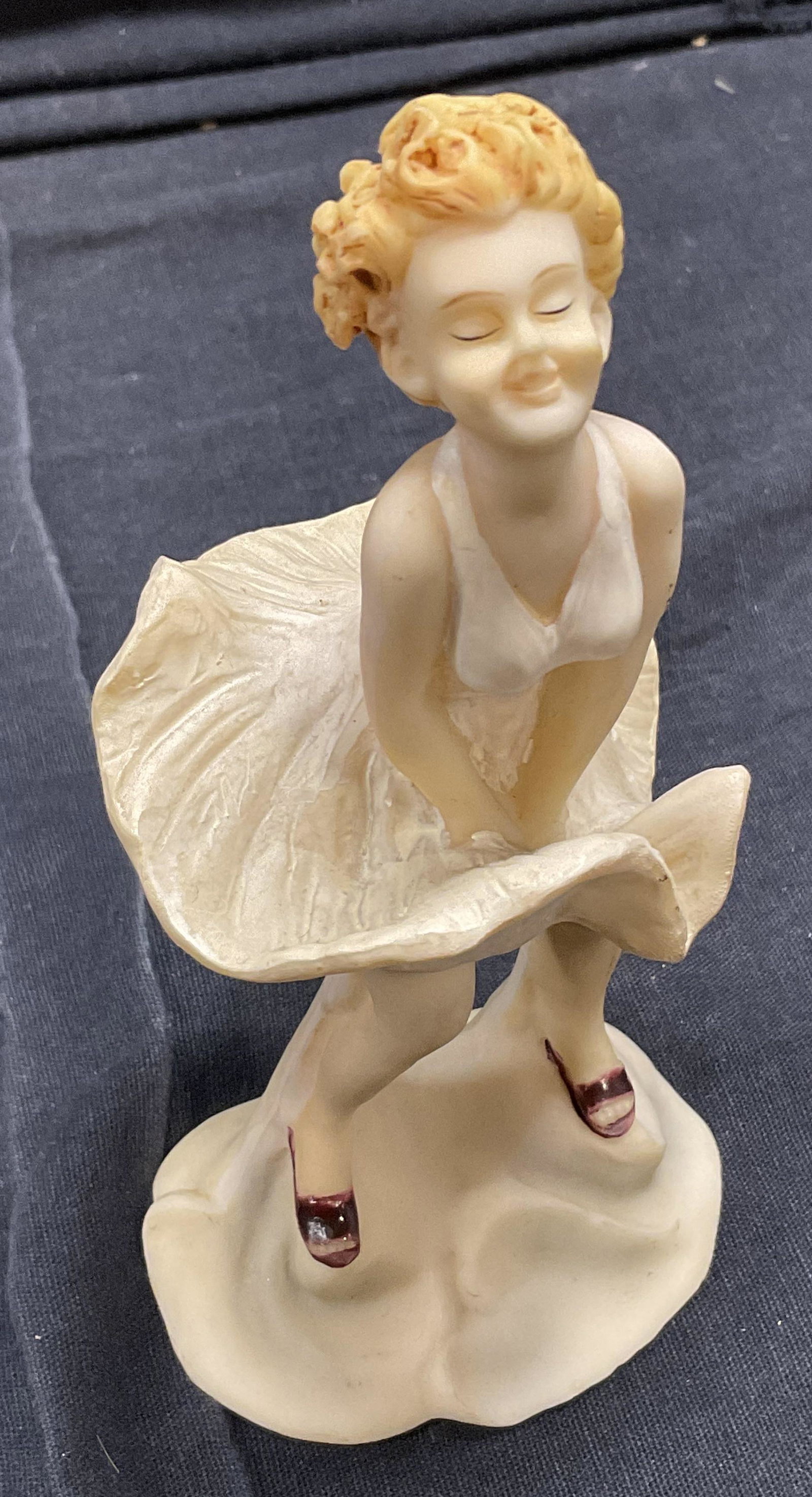 Miniature Figural, Marilyn Monroe: Miniature Figural of Marilyn Monroe. Measures approx 6 x 3 inches. Bottoms label reads K’s Collection. Surface wear to piece consistent with age and use, made of composite material. 11S Home decor, 