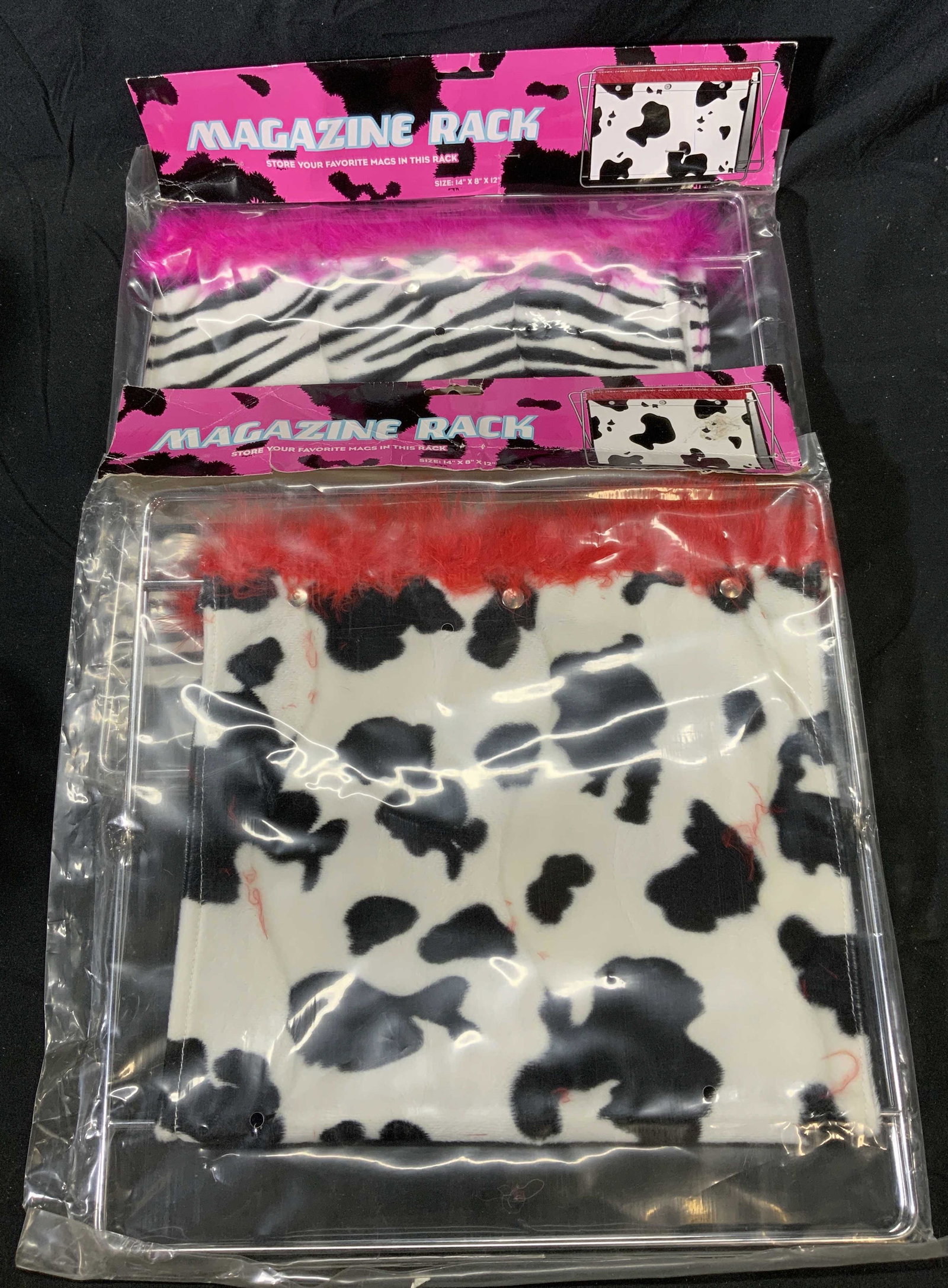 Pair Vintage Animal Print Funky Magazine Racks: Pair of vintage funky style animal print magazine racks. 1 zebra print and 1 cow print. New in original packages. Wear to packages consistent with age and exposure. Magazine racks measure approx. 14 x