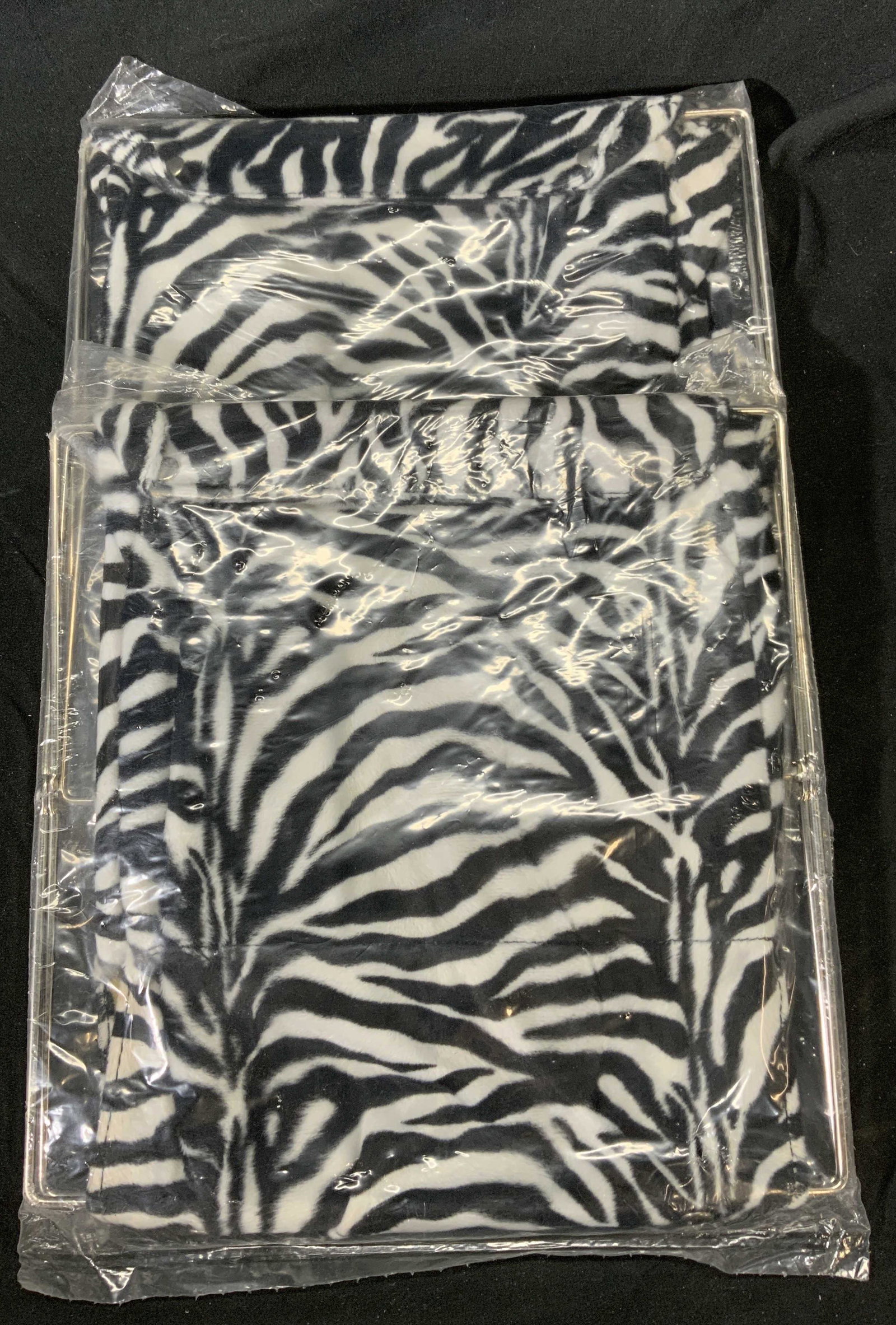 Pair Vintage Zebra Print Magazine Racks: Pair of vintage funky style animal print magazine racks. New in original packages. Wear to packages consistent with age and exposure. Not removed form packaging. Measure approx. 12 x 11.5 inches each.