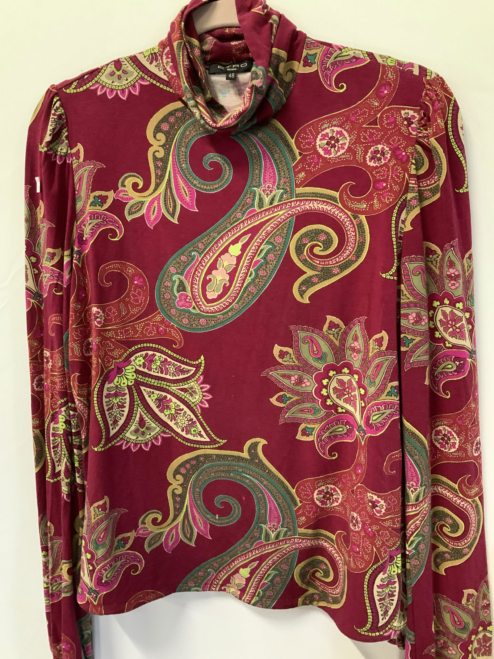 ETRO Milano Paisley Turtleneck: Fuchsia turtleneck with colorful paisley patterns with pops of yellow, green and beige. Size 48 Italian size, labeled ETRO Milano. Vintage wear to viscose and elastin fabric. Property of Manhattan, NY