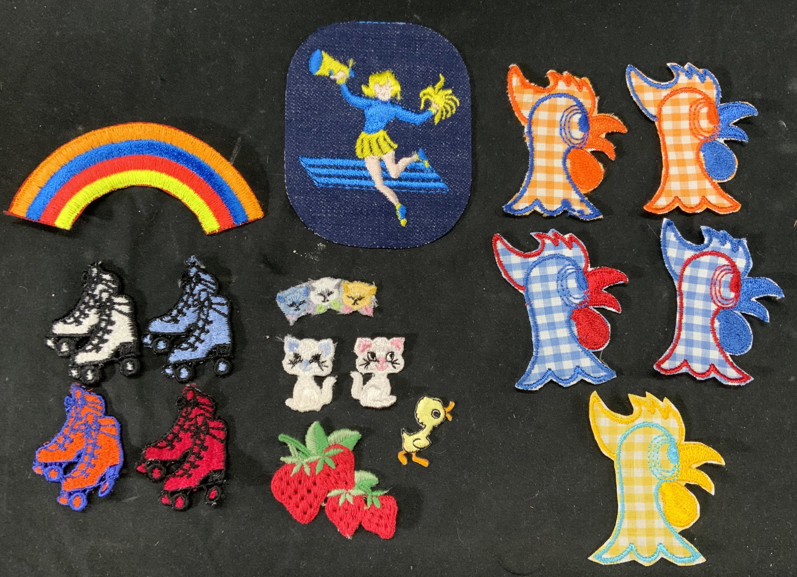 Assorted Vtg Patches, Rainbow, Rooster, Cats, More: Large lot of assorted vintage patches. Includes Rooster patches in various colors, rainbow patches, cat patches, roller skate patches, cheerleading patches, and strawberry patches. Sizes vary. Include