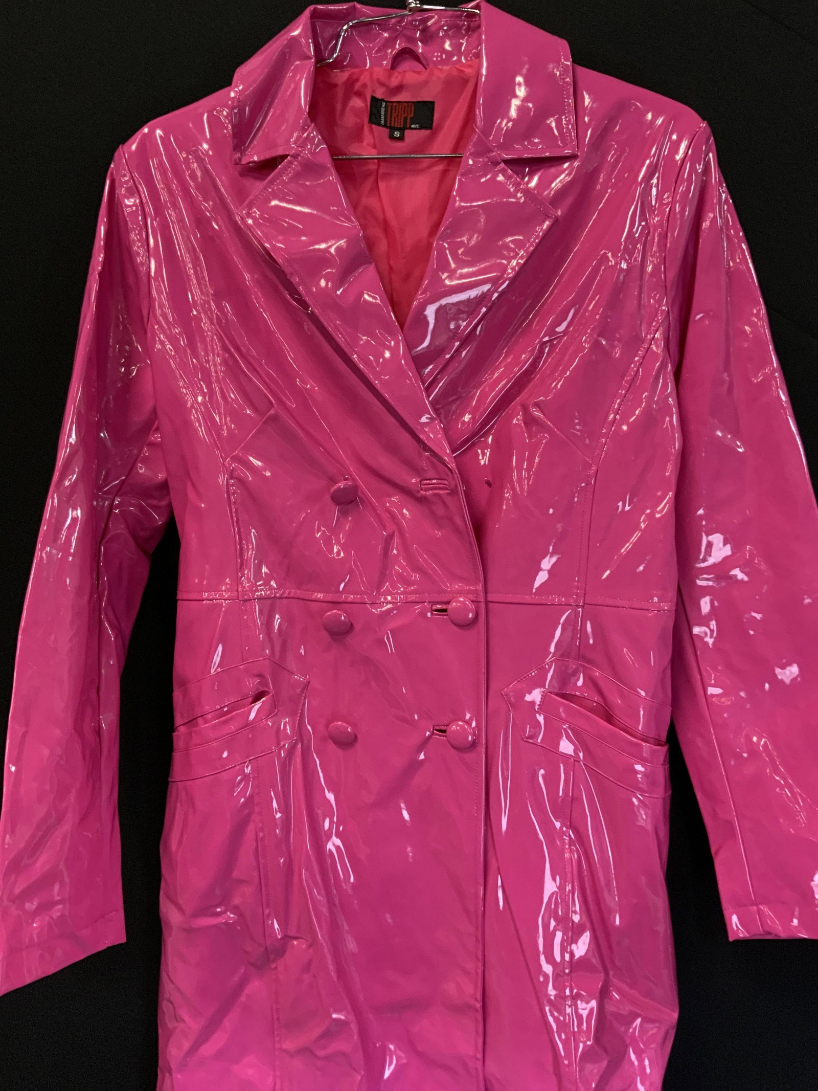 TRIPP NYC Full Length Hot Pink Trench Coat: Tripp NYC vintage hot pink full length trench coat. Double breasted with collar and pockets. Lace up corset detail to back. Size S. One button needs repair. Includes extra button. 100% polyurethane. T