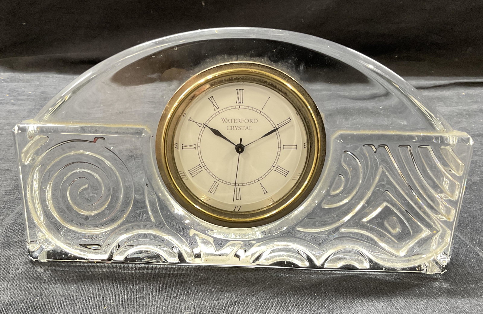 Waterford Crystal Glass Clock, Ireland: Waterford Crystal Glass Clock. Made Ireland. Measures approx 7.5 x 4.5 x 1 inches. Clock is removable. Clock marked ‘Waterford Crystal’. Surface wear consistent with age and use. Bottoms marked Wa