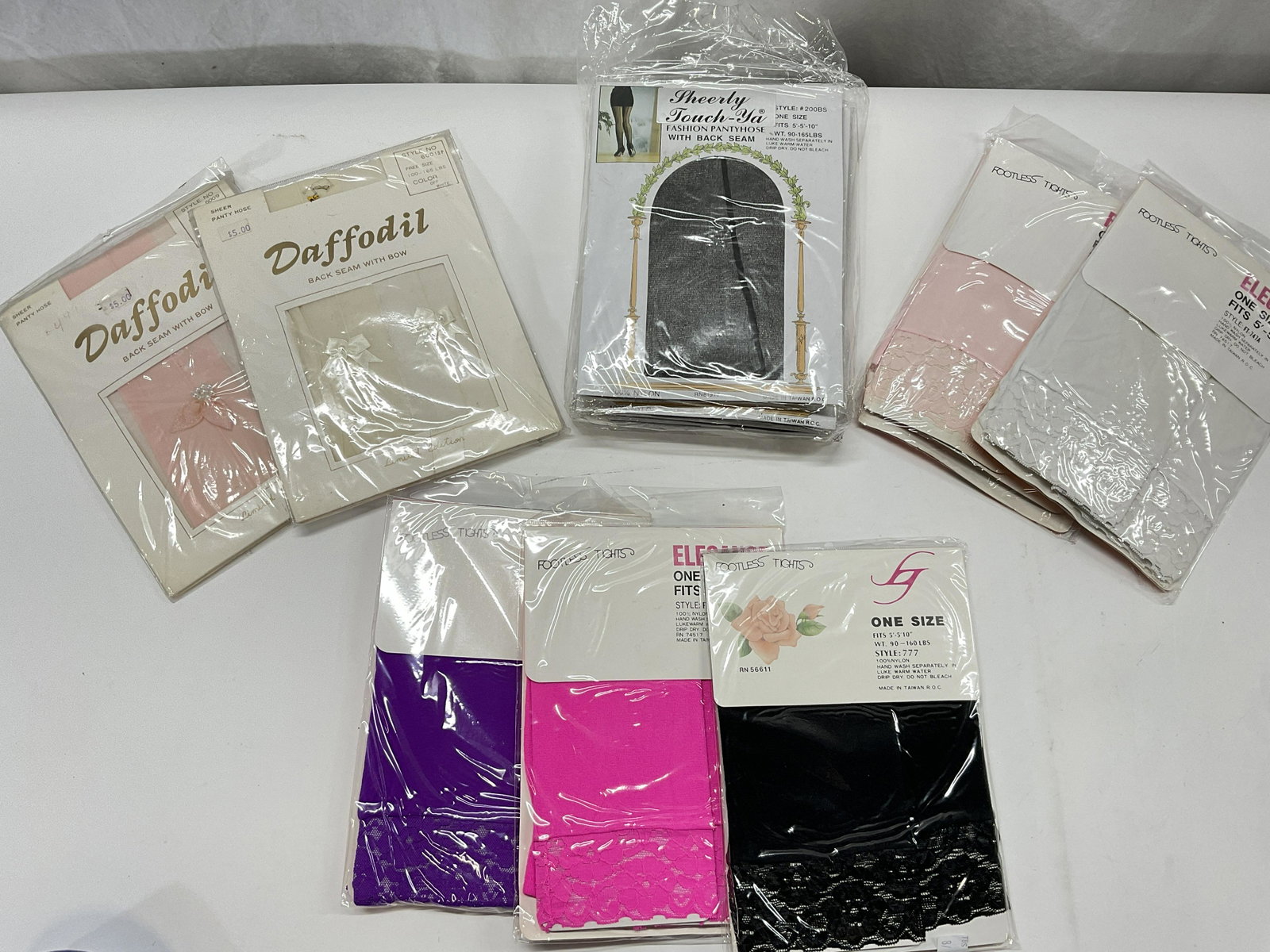 Vintage Lot 12 Womens Tights & Panty Hose NWT: Lot 12 Womens Tights & Panty Hose. Panty hose and Capri Tights are all in original packaging. 2 DAFFODIL with bow, 5 Capri Lace Leggings, One Size fits all, & 5 Pantyhose with back seam. Surface wear 