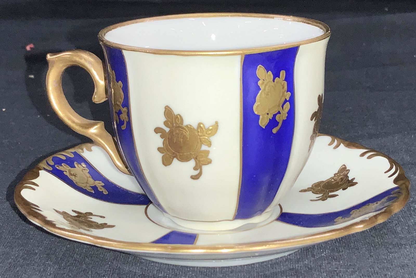MZ Gilt Porc. Demitasse Cup & Saucer, Czech: Hand painted vintage demitasse cup and saucer, fine bone China with hand painted Gilt rose and gilt rim detail, blue and white stripe pattern. Hallmarked on underside MZ hallmark and read Czechoslovak