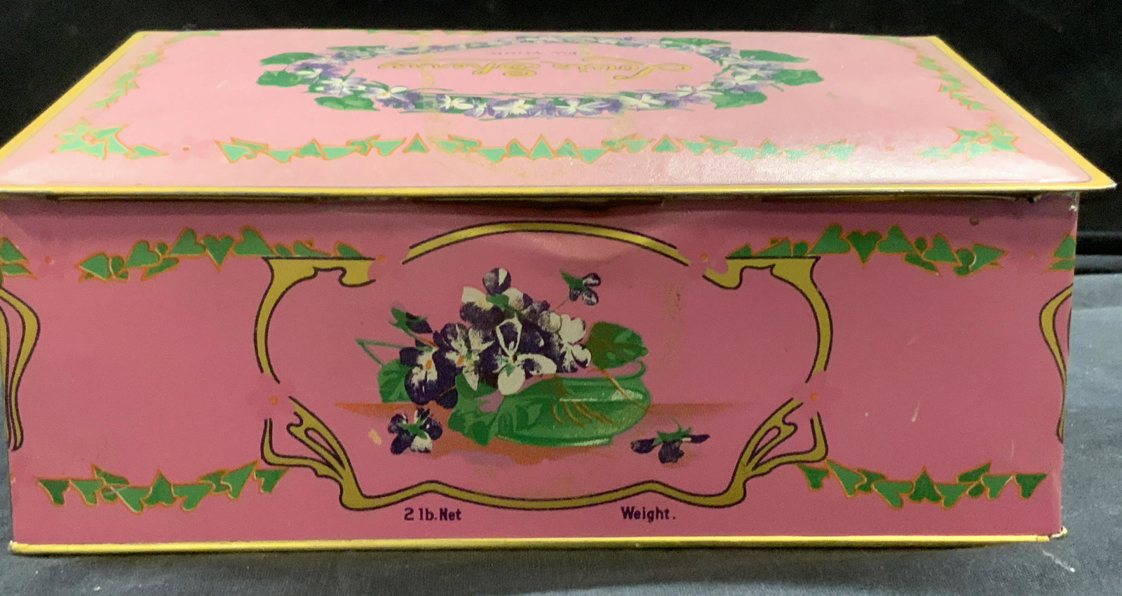 Vintage Collectible Eagle Can Co Louis Sherry Tin: Vintage Louis Sherry Orchid Chocolate Truffle Tin , underside impressed Eagle Can Co. . Pink tole with purple ( possibly Forget Me Not) flowers. Tin is signed , carried 2 lbs of chocolate. lid does no