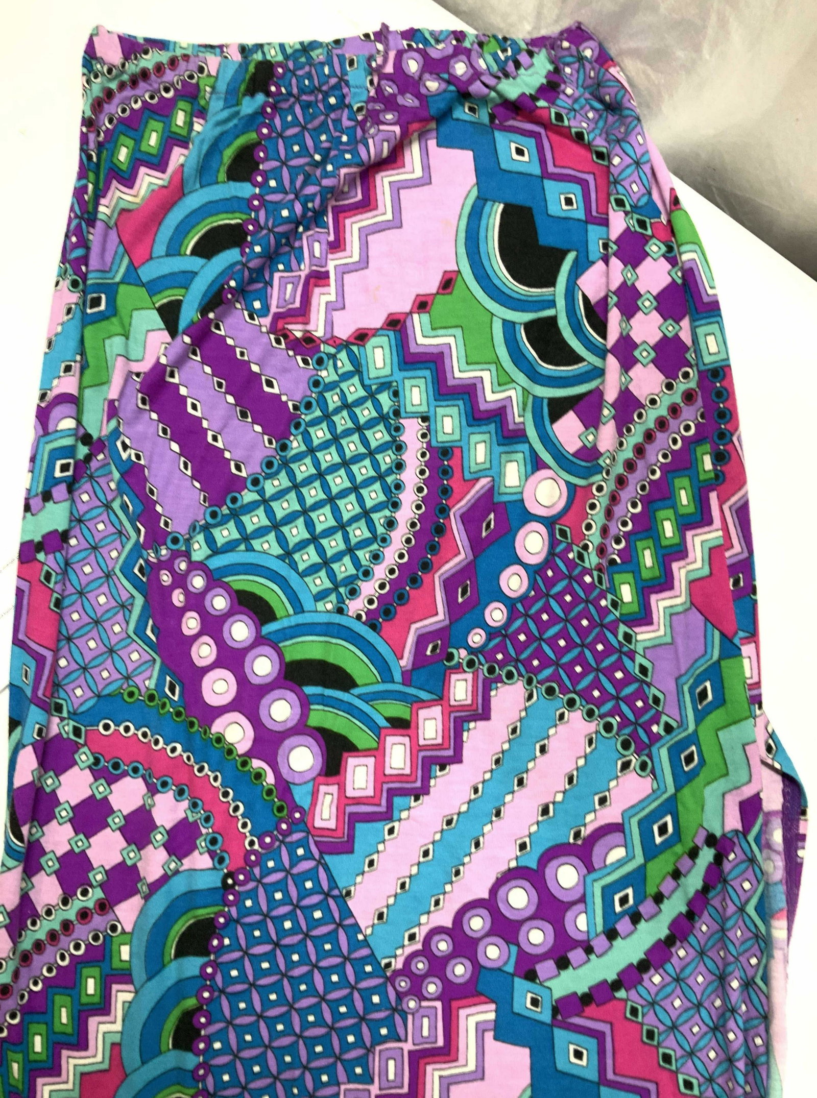 Unlabeled Pucci Style Vtg Psychedelic Skirt: Mid century long cotton skirt with side slit and stretch waist. Psychedelic geometric patterns and colors, in the style of E. Pucci. Bright purple, lavender, aqua, greens and fuchsia, waist 28-40 in w