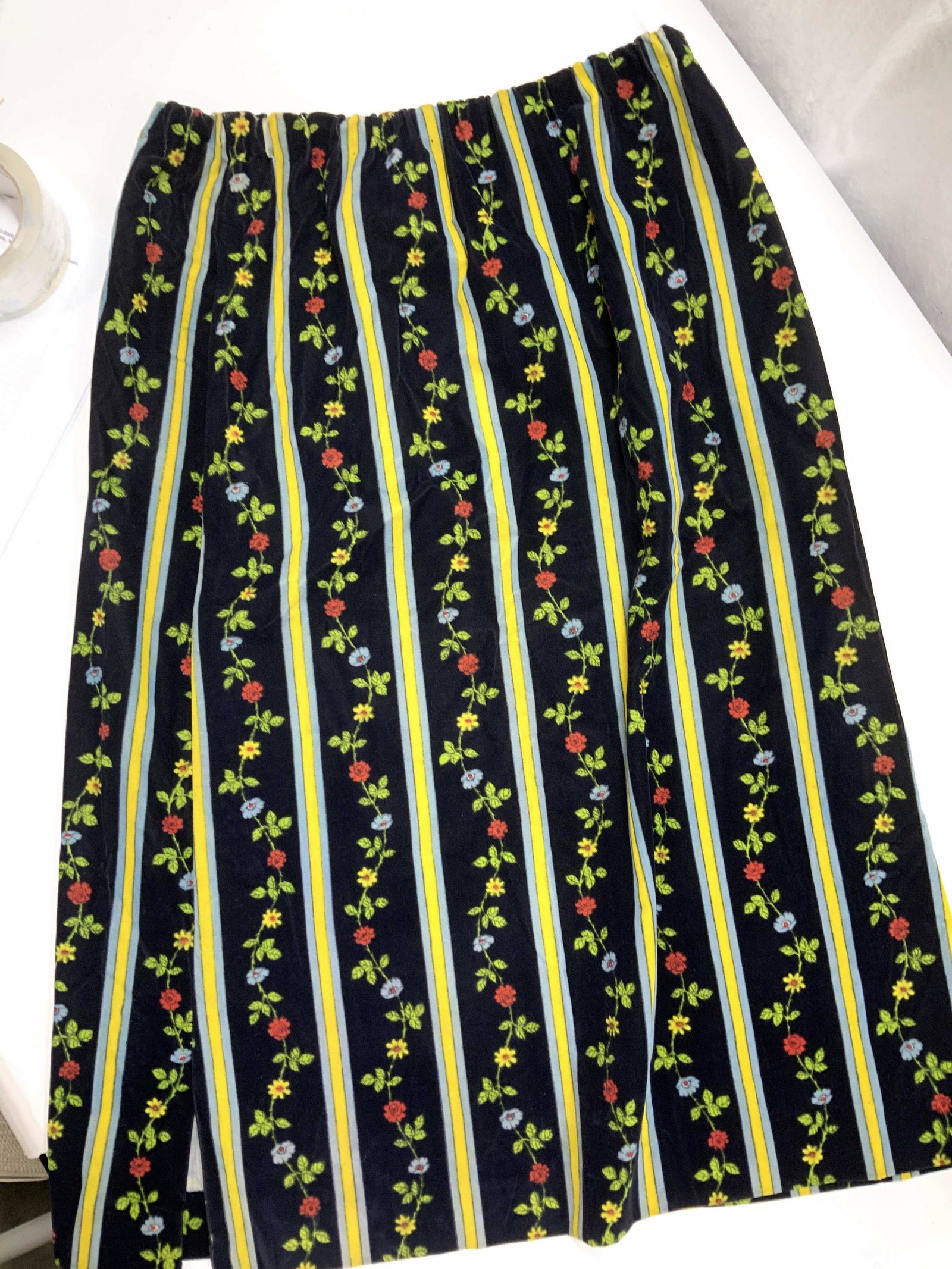 Handmade Vintage Velvet Floral Skirt: Mid century black velvet skirt decorated with linear flowers on vine and stripes. Has a stretch waist, 28-34 in. 28 in. Long. Appears to be handmade. No issues noted. In good vintage condition. 3 Mid 