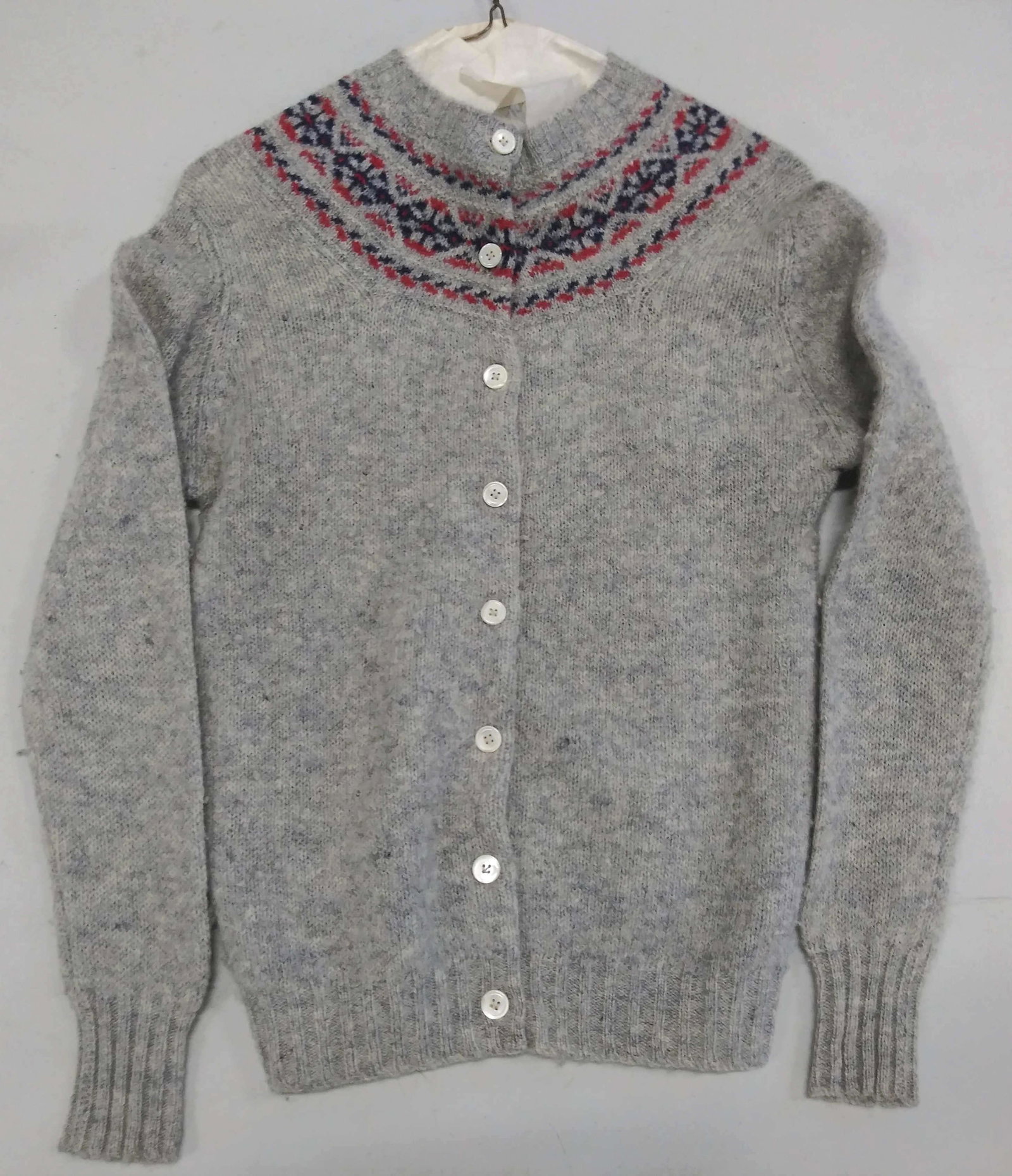 DEANS of SCOTLAND SHETLAND WOOL CARDIGAN: Vintage Shetland grey wool cardigan , hand frame knitted in Hong Kong and SPUN IN SCOTLAND, Original label attached to sweater. Ribbed collar, hem and cuffs, blue and red wool pattern along neckline. 
