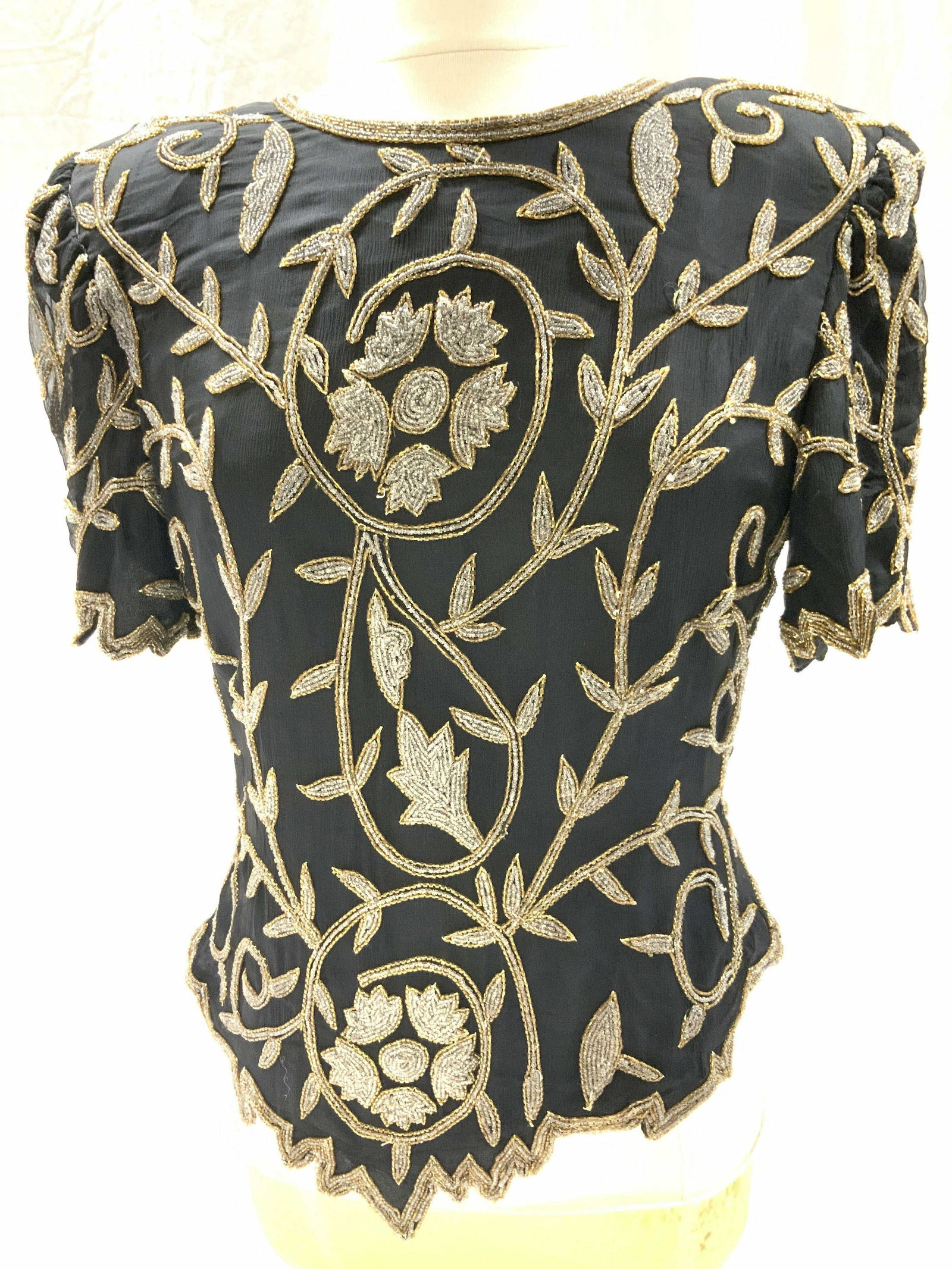 LAURENCE KAZAR SILK Beaded Blouse, 1980s: Ladies heavily beaded black silk cocktail blouse with silver and Carmel seed beads in vine design. Typical of the 1980s fashion with shoulder pad, saw tooth hems, beaded front and back. Backside zippe