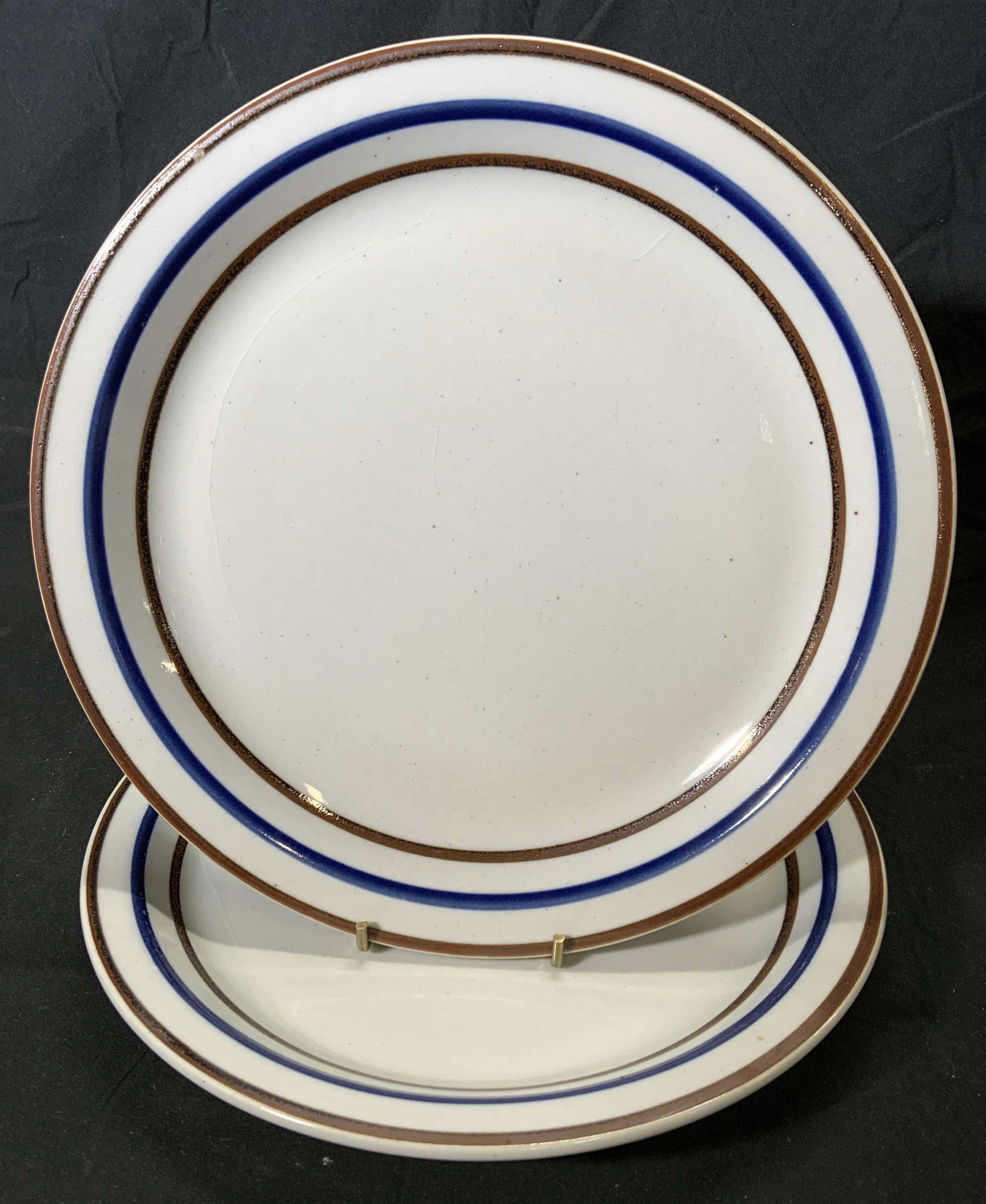 Pair Vintage CORUM CERAM Stoneware Dishes: Pair of vintage CORUM CERAM Japanese stoneware dishes in hues of white, blue, and brown. Measure approx. 12.25 inches diameter. Wear to pieces consistent with age and exposure, crazing. Both pieces tr