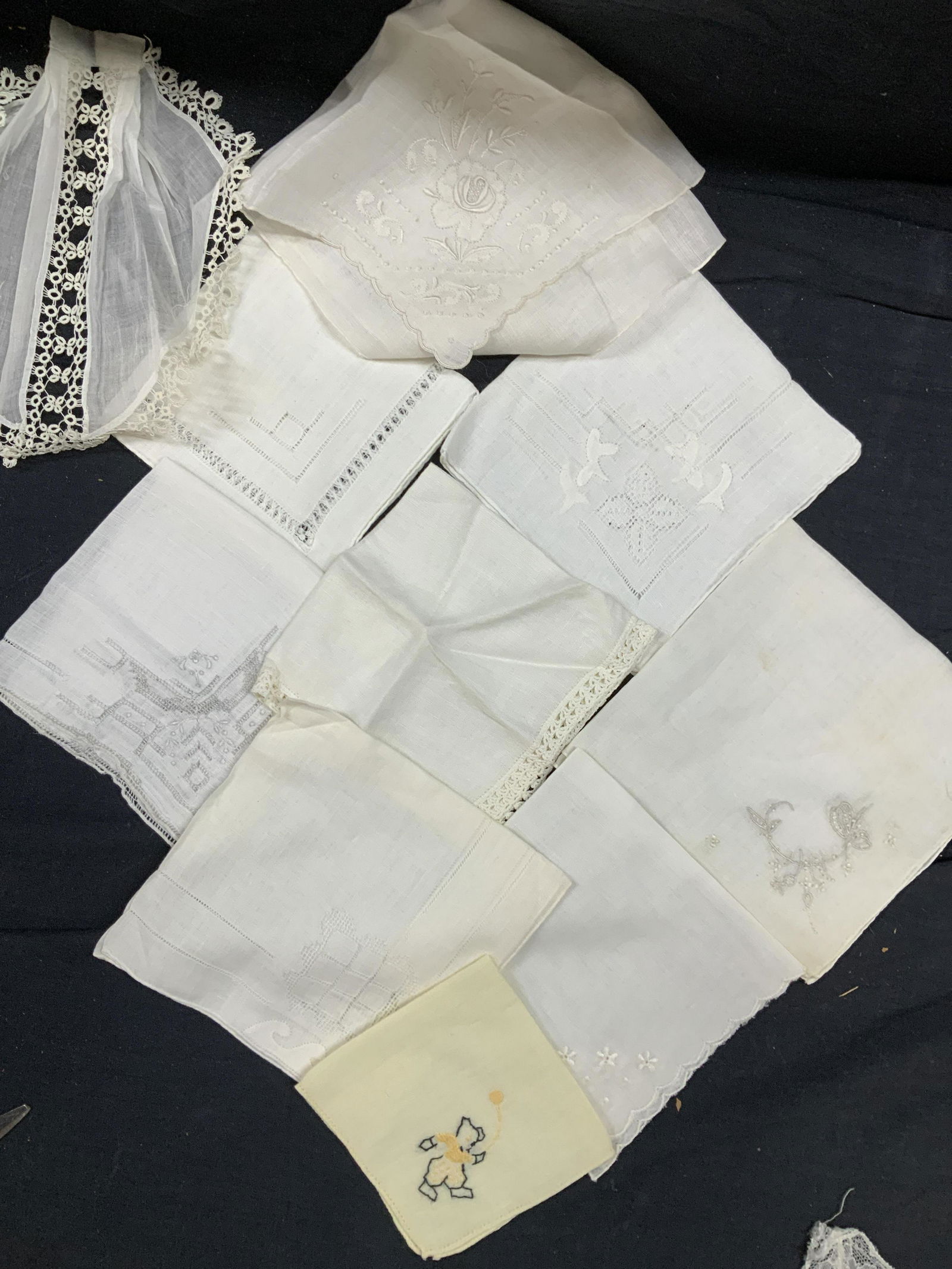 Lot11 Vintage Embroidered White Linen Hankies: Collectible Vintage linen hankies with corner machine embroidery. 1 is floral polyester with scallop edge. 1 oversized with lace border, 17 x 16.5 in. Most in good vintage condition. Collectible Linen